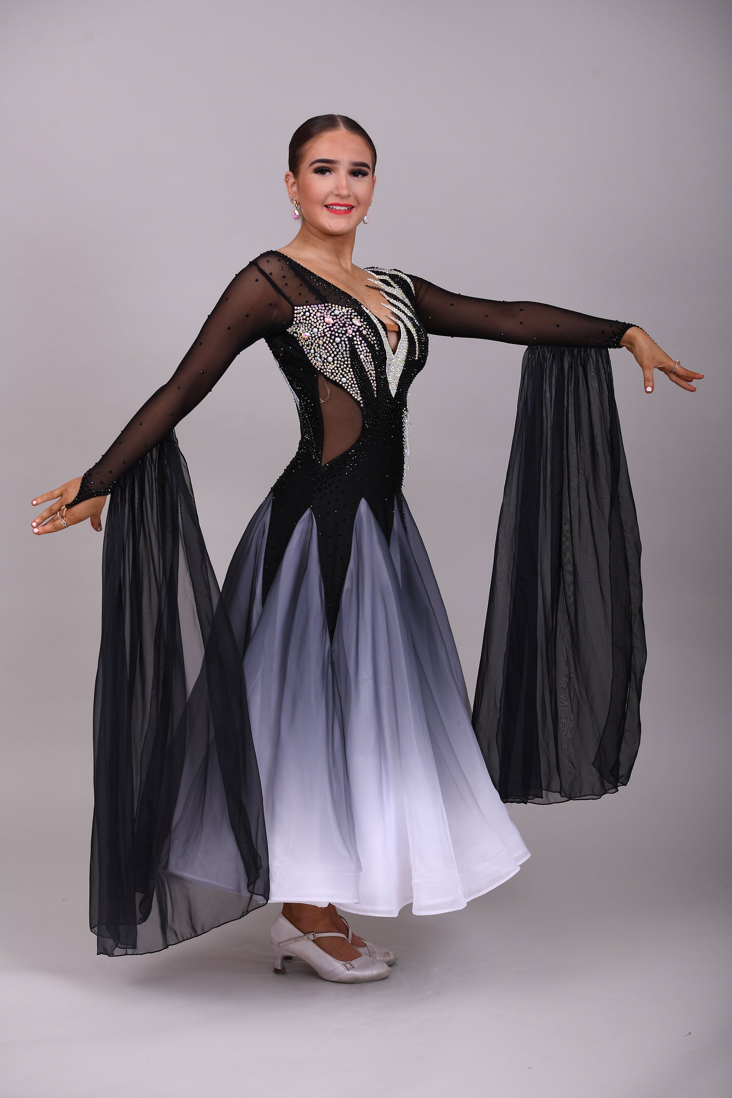 331 White & Black Ombré Ballroom Dress. Detailing to the chest and back. Decorated in Jet and AB stones with floats from the lower arm.