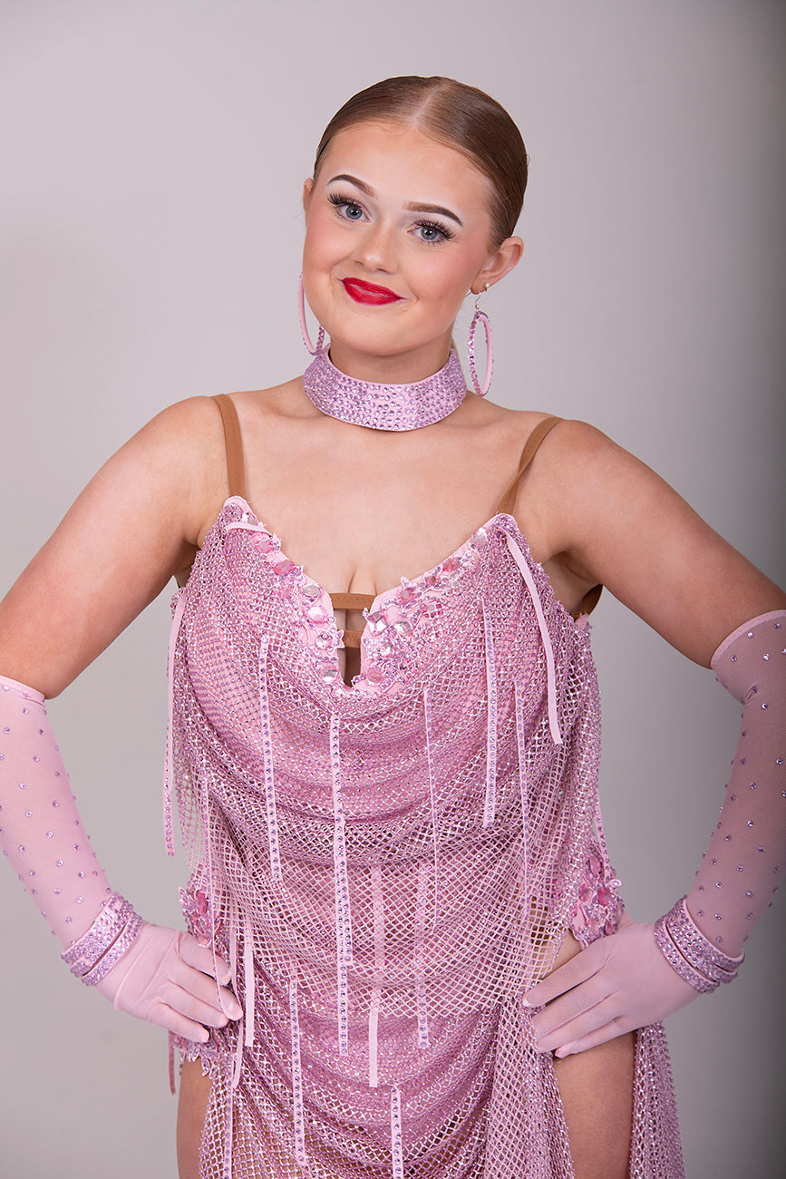 016 Dusky Pink stoned mesh overlay Latin Dress. Stoned in Light Pink with material droppers stoned. Pale pink appliqués with rose stones.