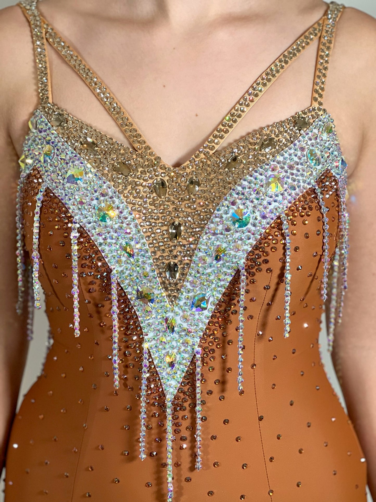 246 Cappuccino Ballroom Dress. Comes with Gloves & detachable glove floats. Stoned in Aurum, Sunshine, Smoked Topaz & Topaz. Strap feature to the back & shoulders