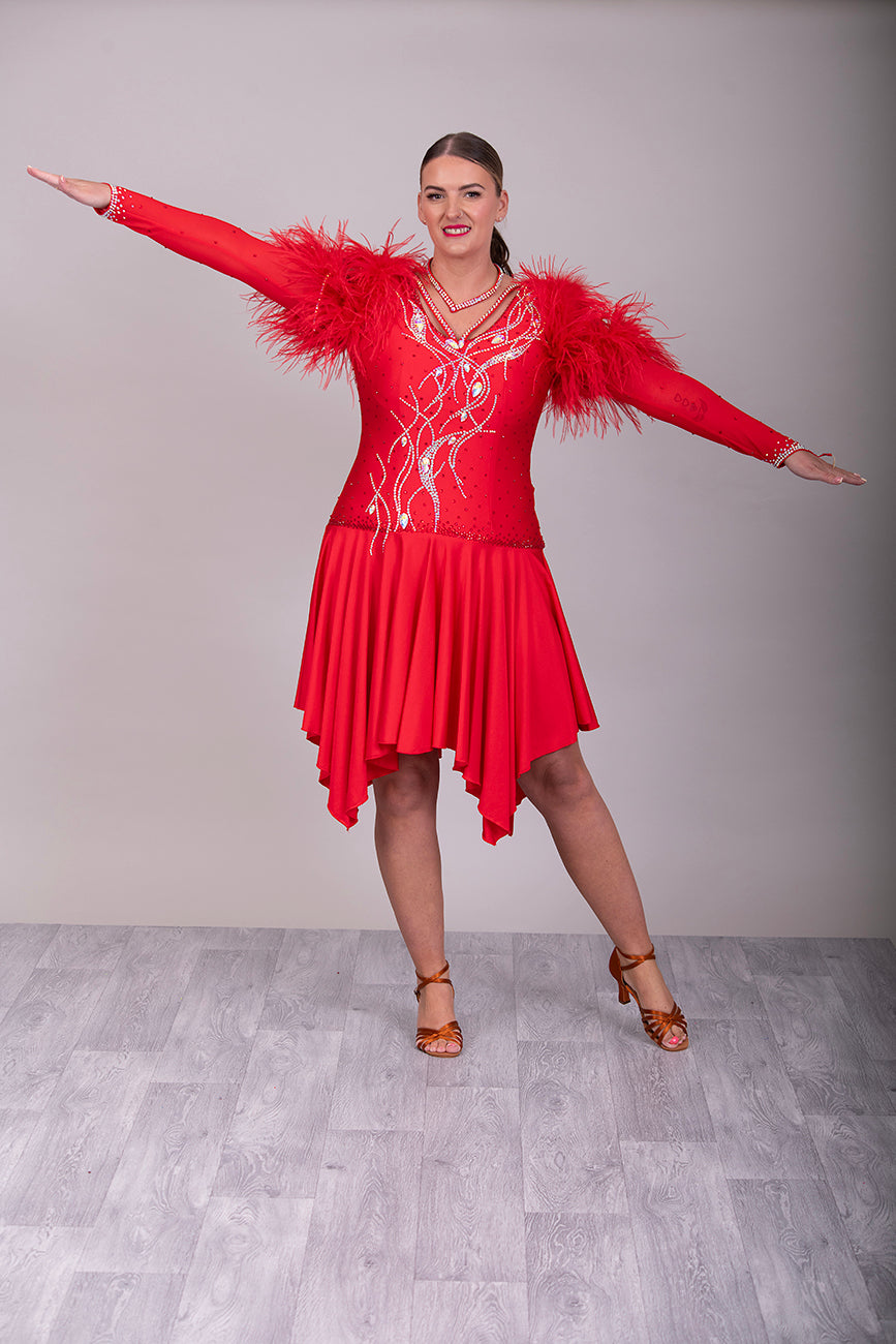 301 Rich Red Competition Latin Dance Dress. Ostrich boa decoration to the upper arm with stoned strap detail. Very full skirt. Stoned in Light Siam & AB