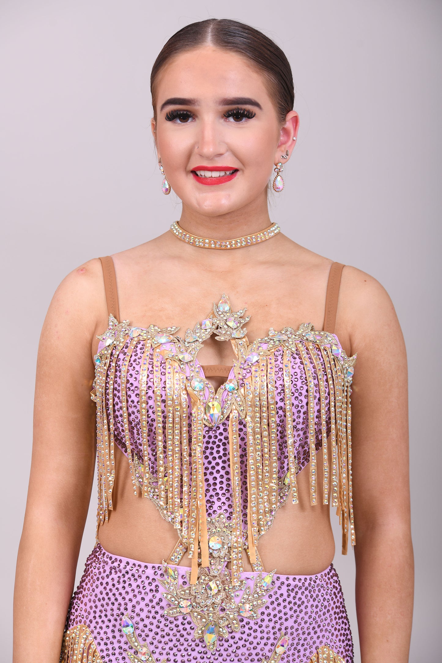 295 Lilac and Gold Latin dress. Gold material droppers stoned in AB. Lilac fabrics all decorated in matching stones.