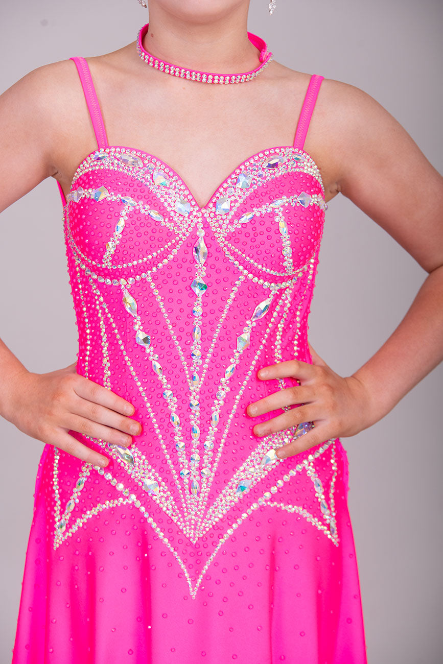 34L Neon Pink Corset style Competition Latin dance dress. Bra cup style bodice with corset effect stoning in AB. Dude splits edged in AB