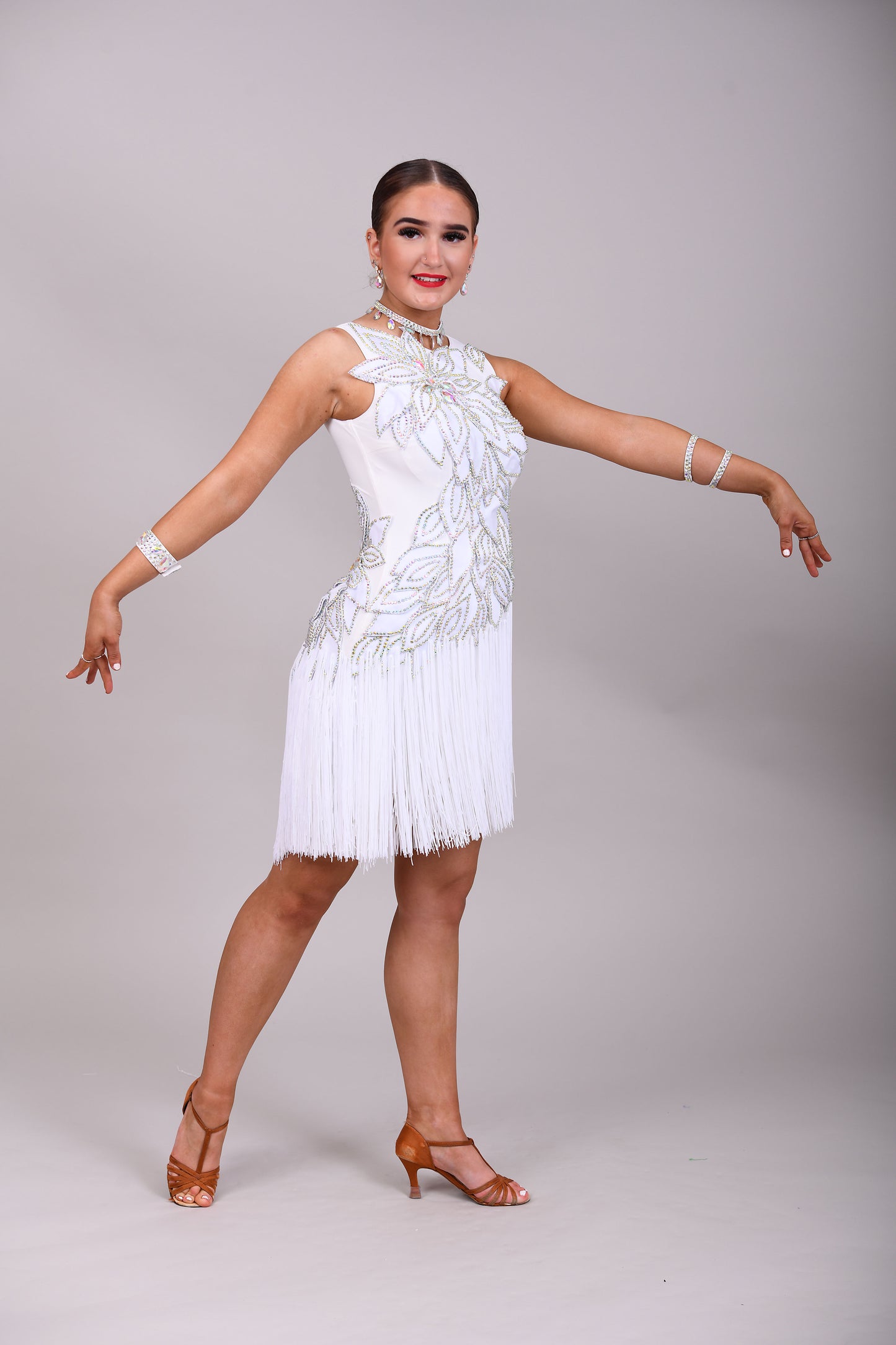 177 White 3D flower & leaf design Latin dress. Fringe skirt with open side detail. Stones all AB