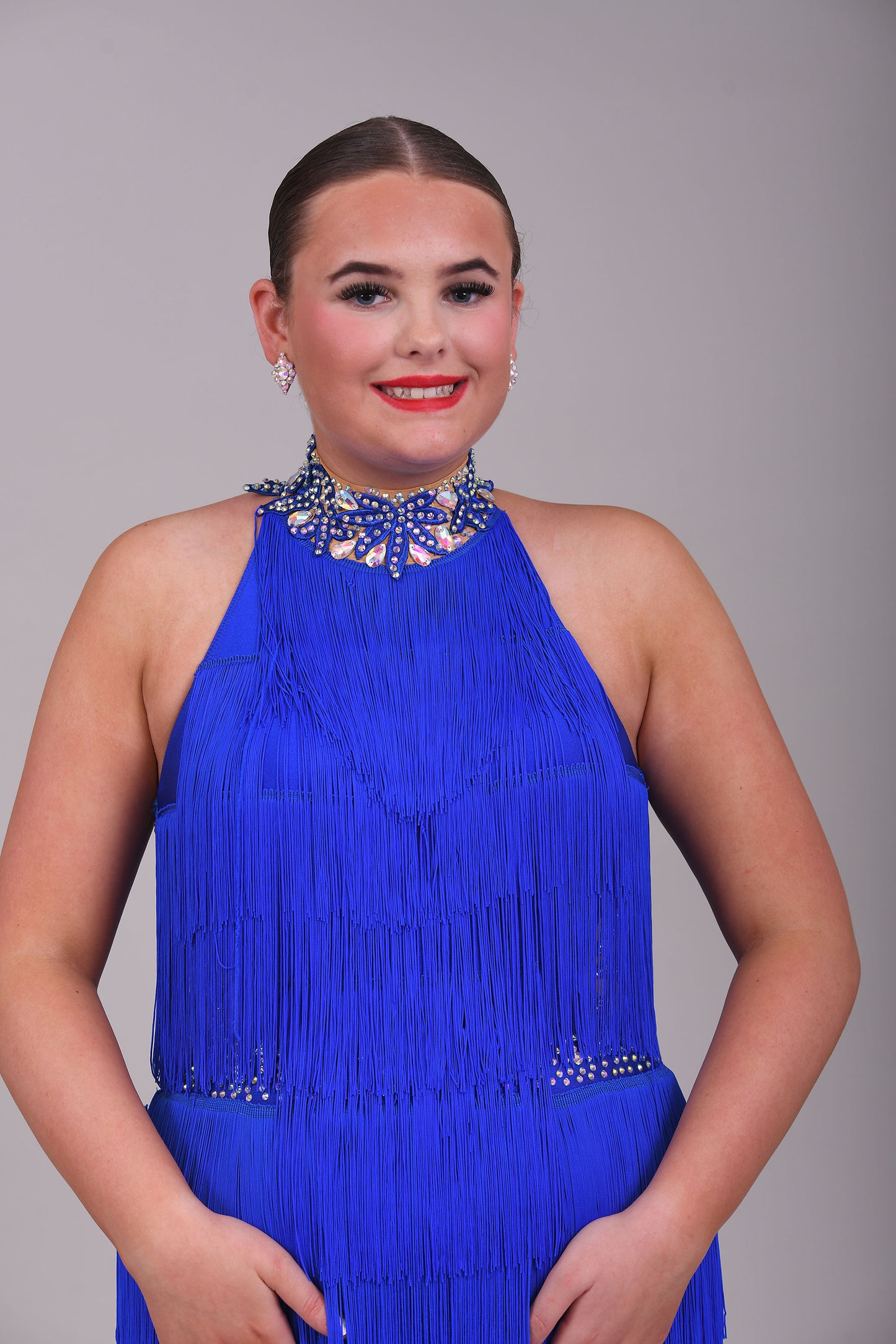 221 Bright Royal Blue Fringed Leotard & separate fringe skirt. Appliqué detailing to the waistband & Collar with flesh Lycra panels to the sides decorated in appliqué. All stones are AB & Sapphire.