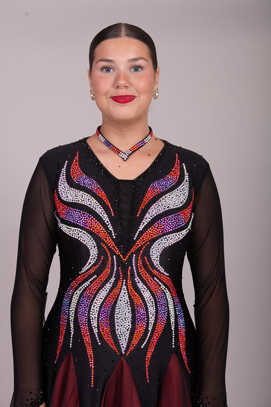 39B Red Black & Orange Ombre Competition Ballroom/Sequence Dance Dress. Ombre stoning in Oranges through to AB. Black & Red Ombre skirts with full back coverage. Detachable Floats complete this beautiful dress