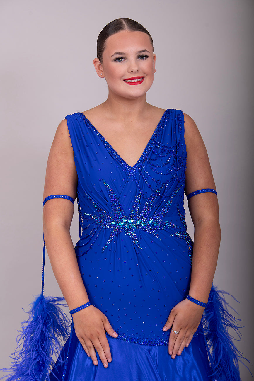 9000 Striking Bright Royal Blue Ballroom Dress. Decorated in sapphire, sapphire AB & aqua. Comes with x2 sets of Detachable floats & stunning necklace.