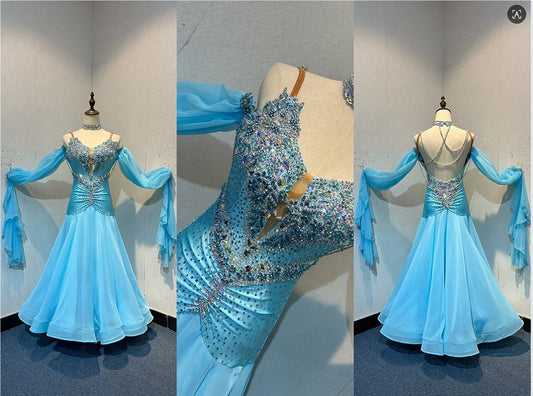 72B TWD Petite Beautiful Blue Competition Ballroom/Sequence Dance Dress. Heavy appliqué stoning to upper chest in Light Sapphire & AB. Separate puff arms with detachable wrist floats. ❤️Showroom Appointments Available❤️