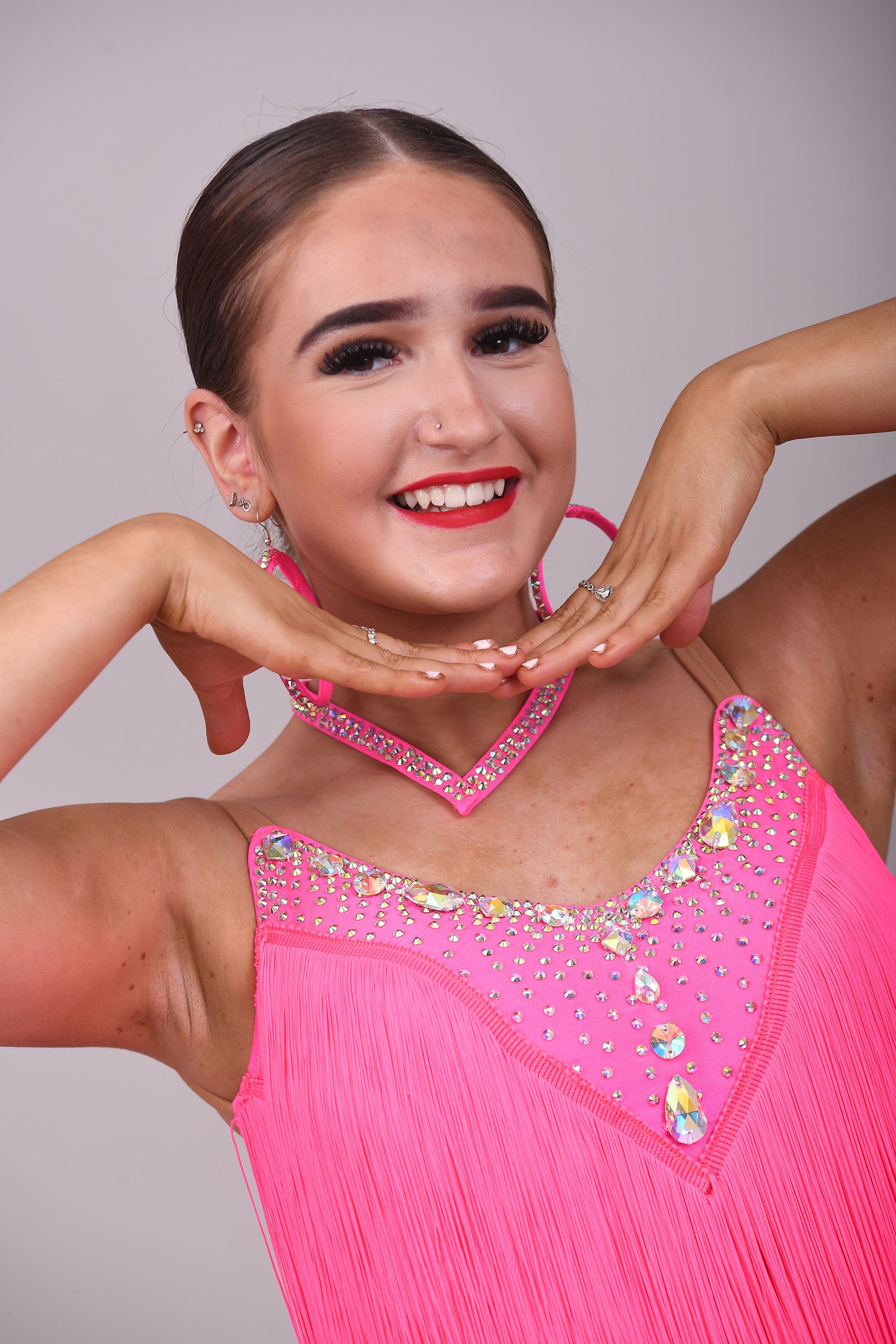 303 Flo Pink Latin Dress. Full fringed skirt decorated in AB Stones & open back detail