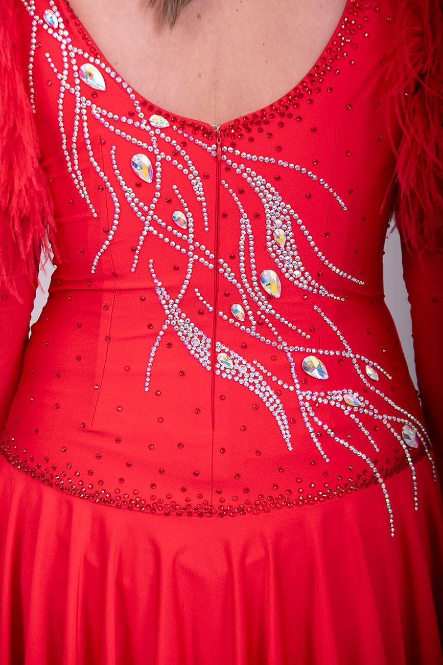 301 Rich Red Competition Latin Dance Dress. Ostrich boa decoration to the upper arm with stoned strap detail. Very full skirt. Stoned in Light Siam & AB