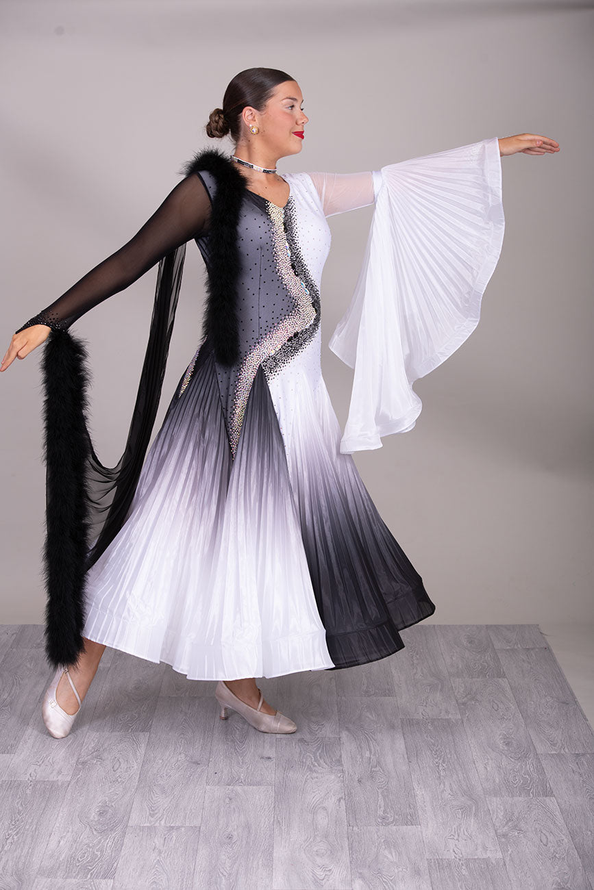 33B  “TWD ELITE” Ballroom/Sequence Competition Dance Dress
High Back allowing option to wear own Bra. Pleated Skirts in Black & White Ombre Pearl Chiffon. Pleated bell sleeve to 1 arm. Finger loop can be added. 
❤️Showroom Appointment Available❤️