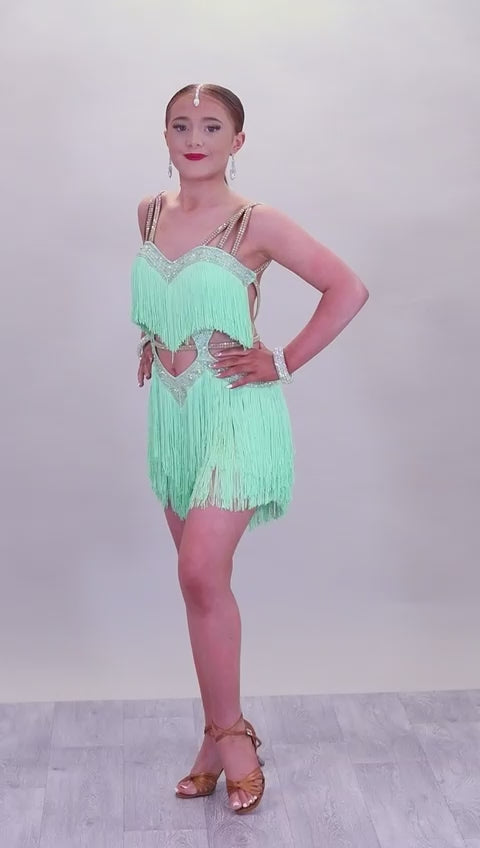 (BUDGET)2 Green Latin Competition Dance Dress. Full Fringed Skirts with shoulder & waist detailing. 2 Bangles included.                                     *****Our New Budget Range are Bought in ready made Costumes, with some detail added by TWDance*****