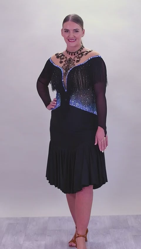 279 Black Competition Latin Dress. Stoned in Sapphire AB & Jet stones. Off the shoulder effect mesh. Black fringe detail to front & back. Full frill skirt giving lovely movement.