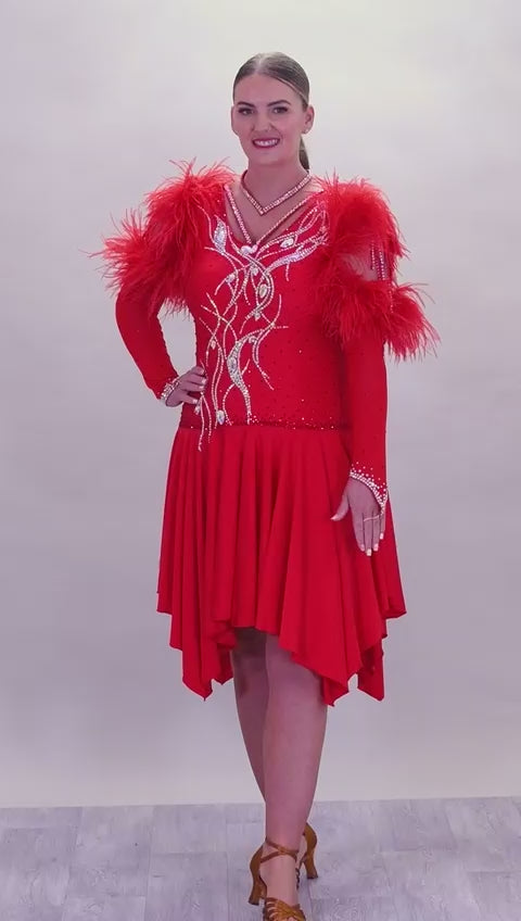 301 Rich Red Competition Latin Dance Dress. Ostrich boa decoration to the upper arm with stoned strap detail. Very full skirt. Stoned in Light Siam & AB