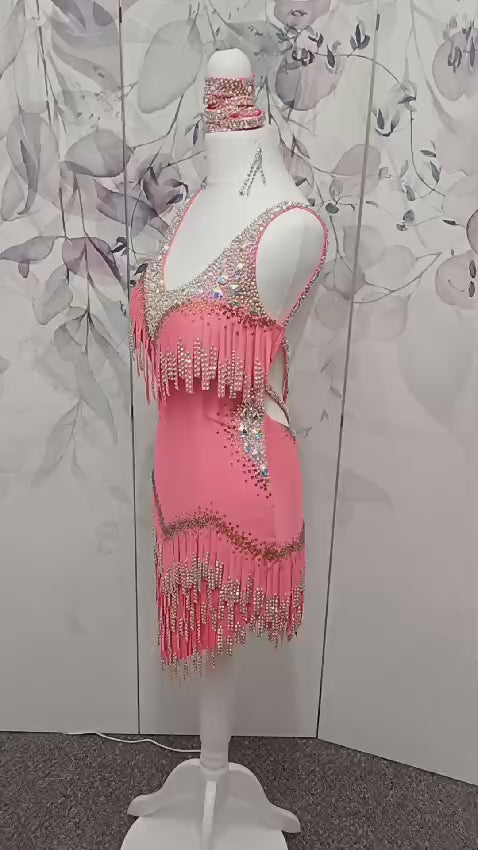 003 Coral Competition Latin Dance Dress. Full stoned fabric fringe details to chest and skirt. Includes bracelets. Stoned in AB & Hyacinth AB