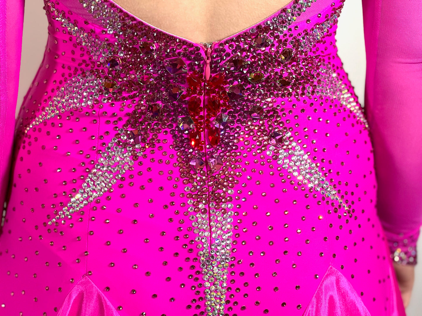 028 Bright Magenta Pink Ballroom dress. Boat neck with Strappy detail to the back. 3D decoration to the left shoulder. Stoned in light Siam, fuchsia,  light rose & crystal AB