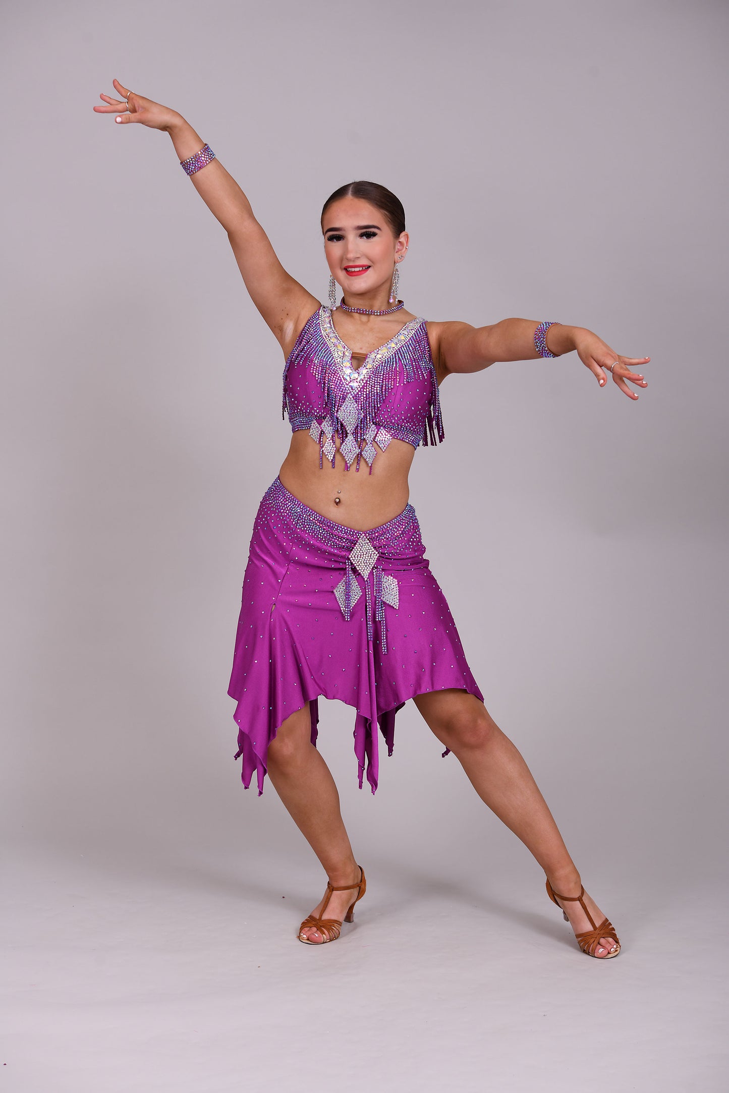 186 Stunning Latin 2 Piece. Full handkerchief skirt. Skirt comes with a choice of 2 tops. Stoned in Fuchsia AB & Fuchsia. Please add note at checkout choice of top required.