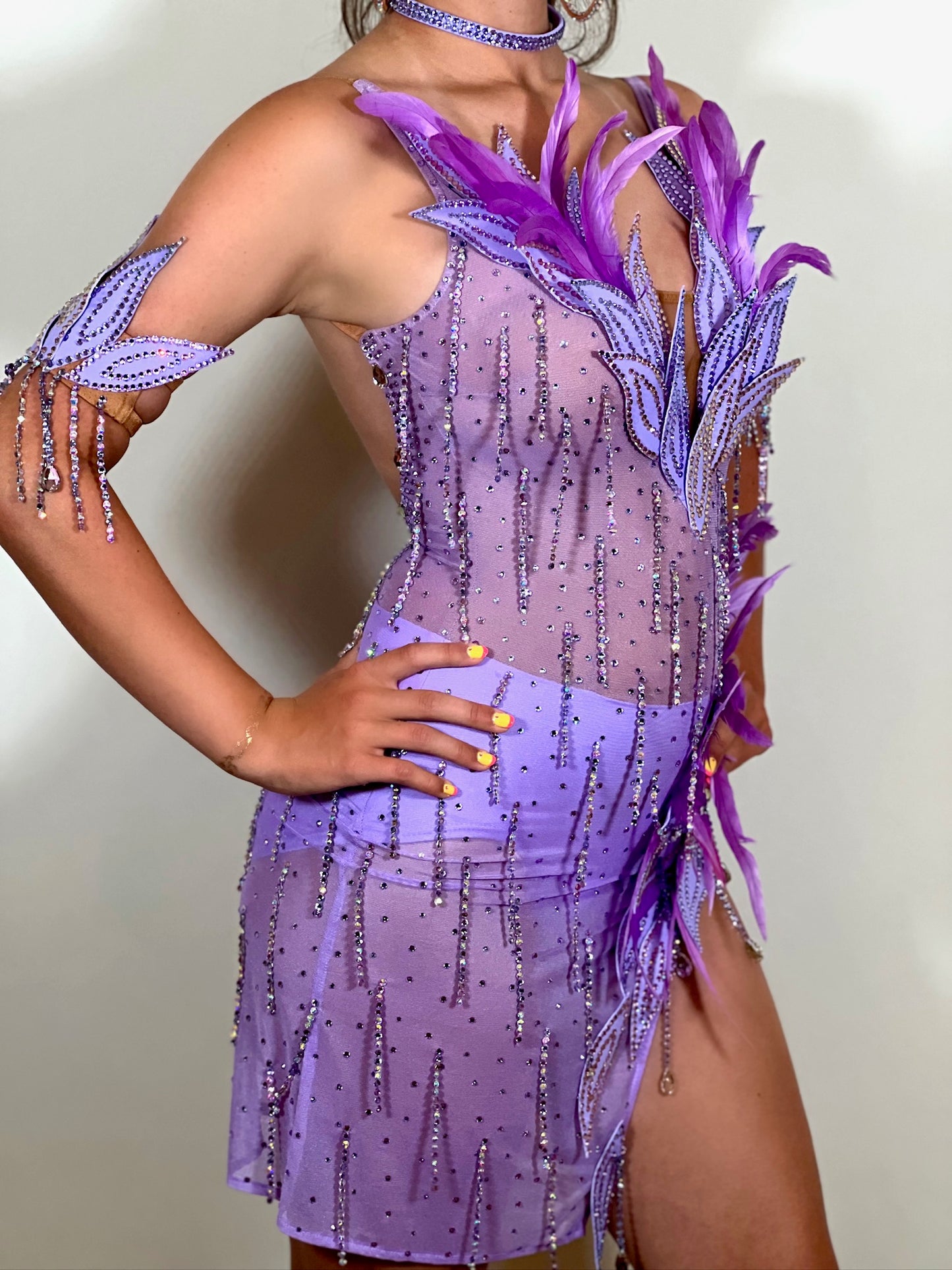 160 Lilac Latin dance dress. Stunning feather detailing to the upper chest & hip. Mesh fabric dress.