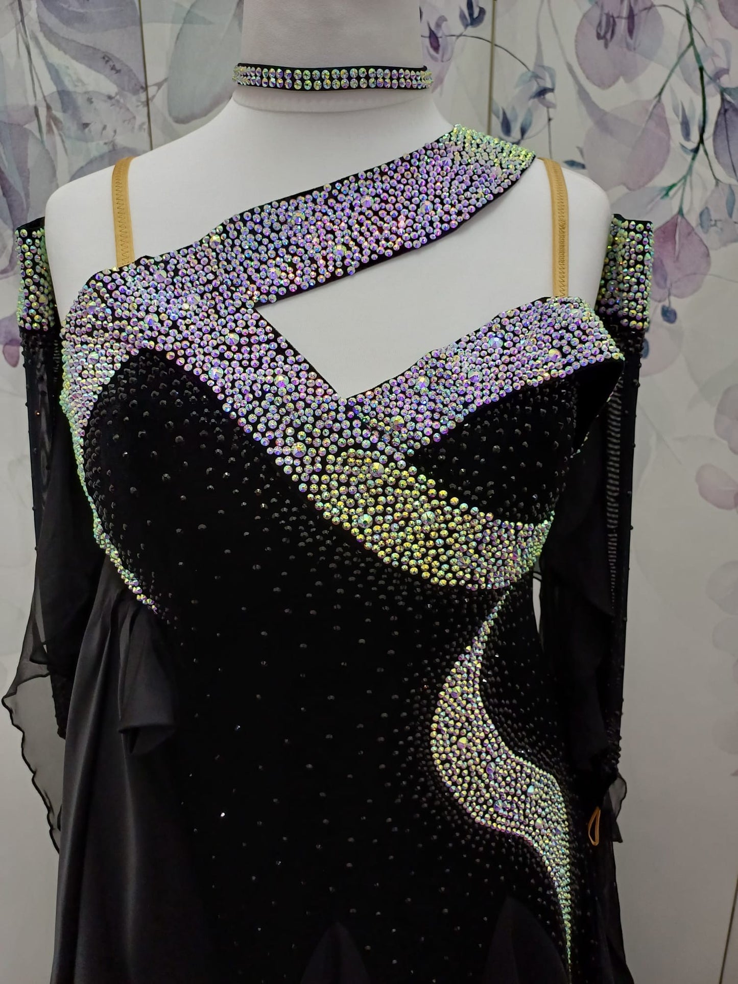 64B Classic Black Competition Ballroom dance dress. Flattering design heavily stoned in AB & Jet. Detachable floats. Satin frill to the front right bodice. Back high enough to wear own bra.
