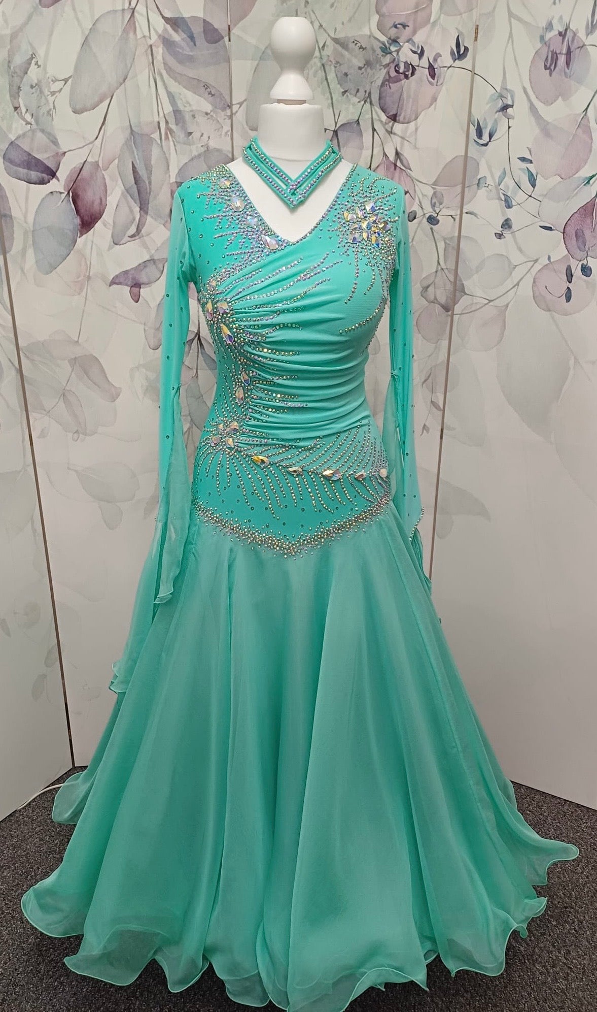 051. Stunning Mint Green Competition Ballroom Dance Dress. Heavily stoned in AB with Mesh detailing to the front. Detachable floats