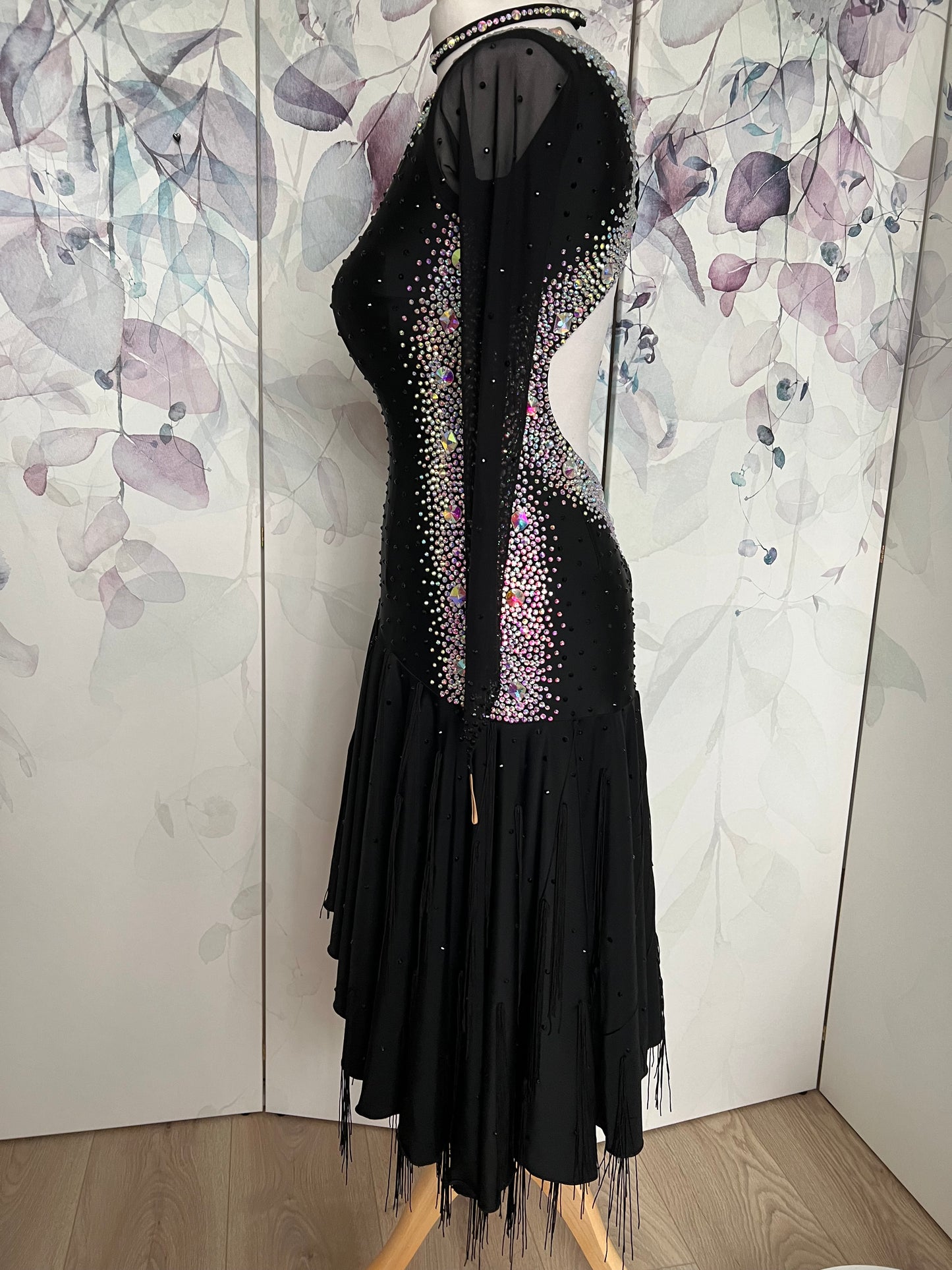 230 Black Latin dress. Stoning in AB to the sides back and back detailing. Fringe & stone detail to the handkerchief skirt