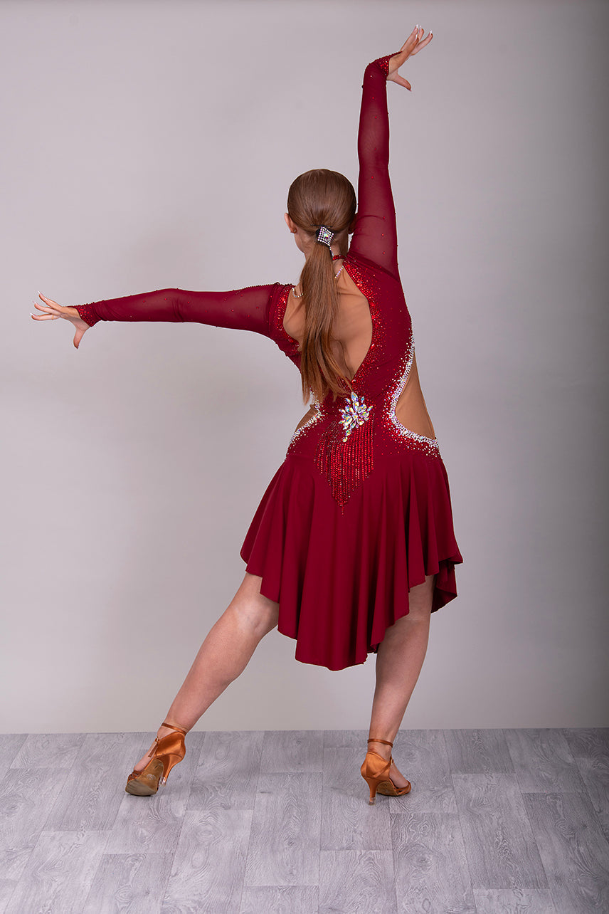 052 Wine Colour Latin Competition Dance Dress with heavily stoned stunning design in AB & Dark Siam High Mesh Back to give option of wearing own Bra. Flesh colour Lycra side panels (not see through) giving the illusion of cut outs.