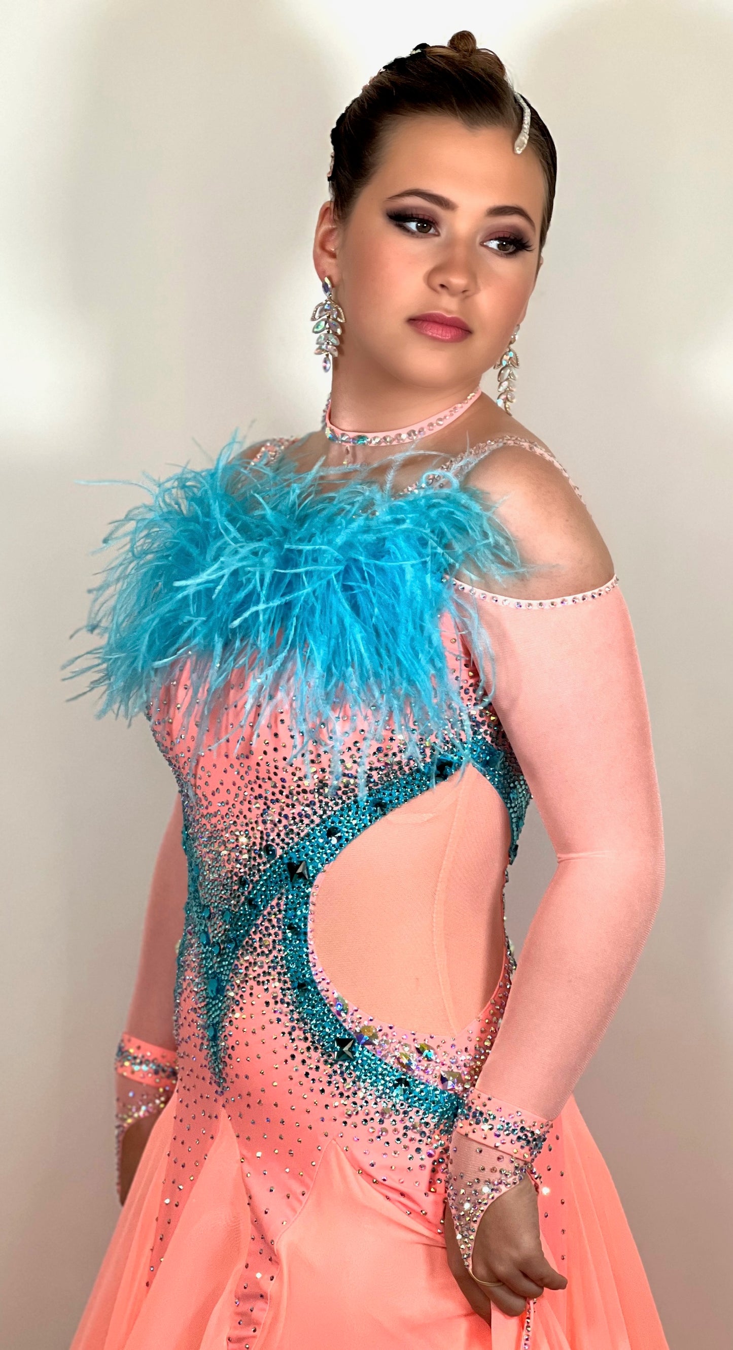 0111 Peach & Paradise Blue Competition Ballroom Dance Dress. Ostrich feather boa floats & detail to  the upper chest. Stunning stone decorations in paradise blue & AB