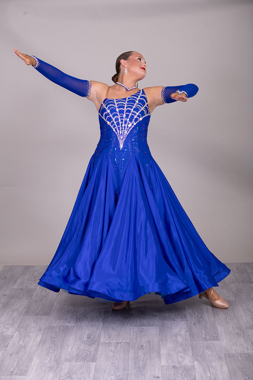 34B “TWD ELITE” Ballroom/Sequence Competition Dance Dress New Fuller Skirts & Underskirts. Striking Royal Blue Dress with web design in AB and Sapphire stoning on the bodice. Beautiful back detail with separate gloves


❤️Showroom Appointment Available❤️