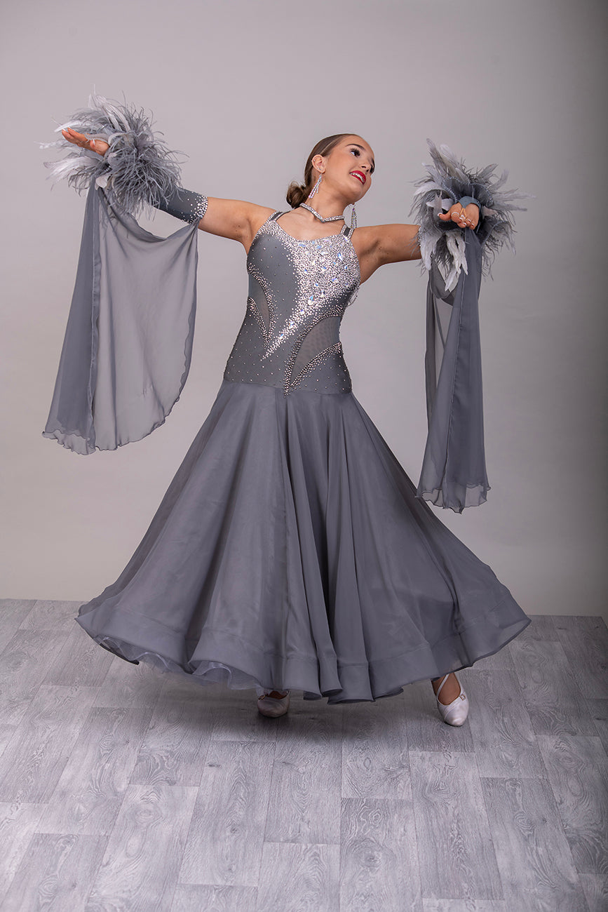 18B Hematite Ballroom/Sequence Competition Dance Dress. Heavily Stoned in AB, Moonlight & Jet Hematite. Detachable Floats & extra Feather Cuffs. Necklace with hanging details to the back.