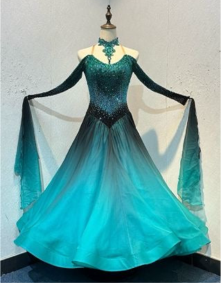 62B TWD ELITE - PETITE Competition Ballroom/Sequence Dance Dress. Heavily stoned with Ombré stone effect. Teal & Black Ombre Chiffon. New Fuller Skirts & Underskirts. Detachable floats at wrists. ❤️Showroom Appointments Available❤️