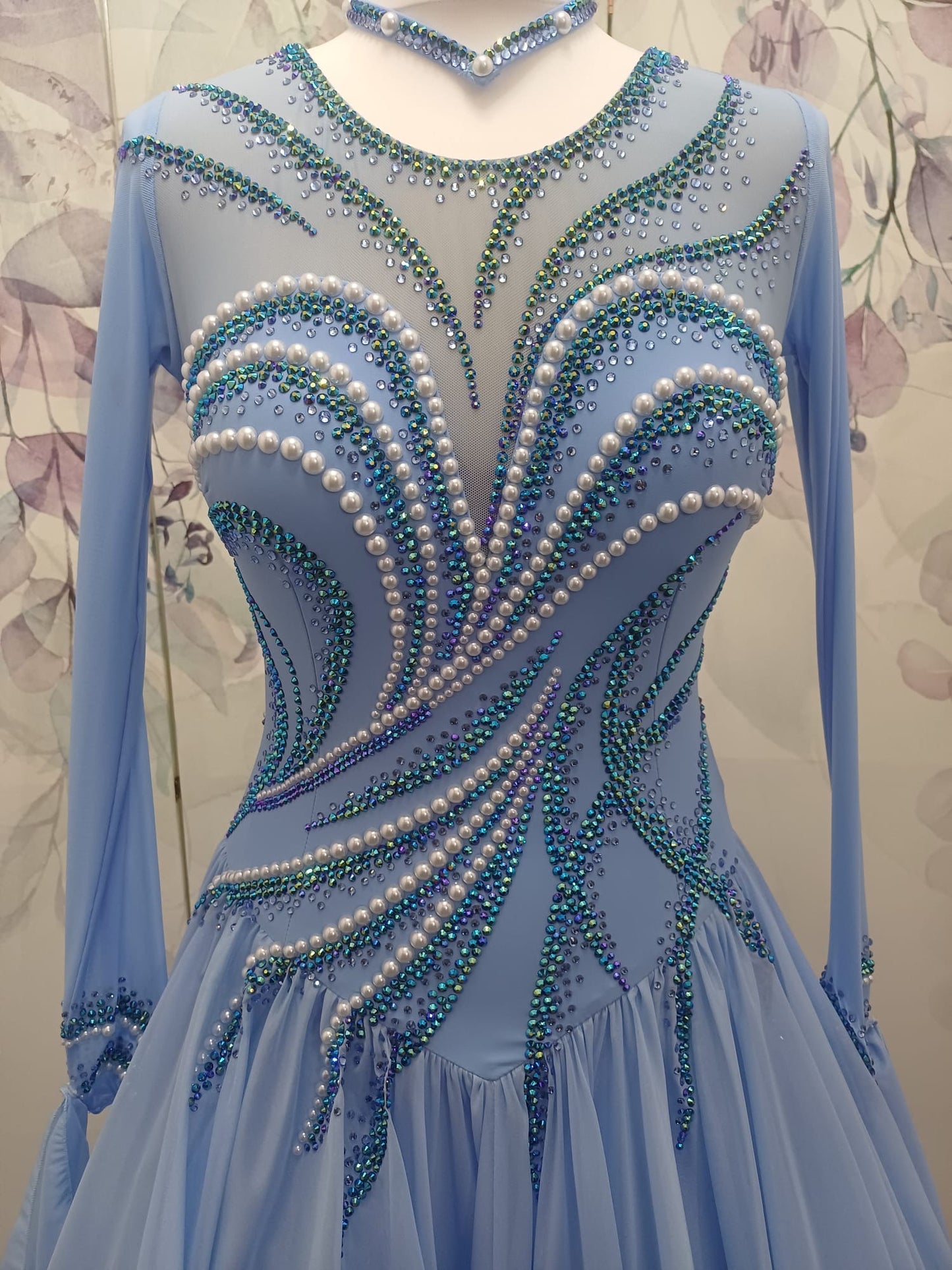 60B TWD ELITE Sky Blue Competition Ballroom/Sequence Dance Dress. New Fuller skirts & Underskirts. Beautiful patterning in Light Sapphire, AB & Light Sapphire AB with White Pearls. Narrow keyhole back. Detachable floats.❤️Showroom Appointments Available❤️