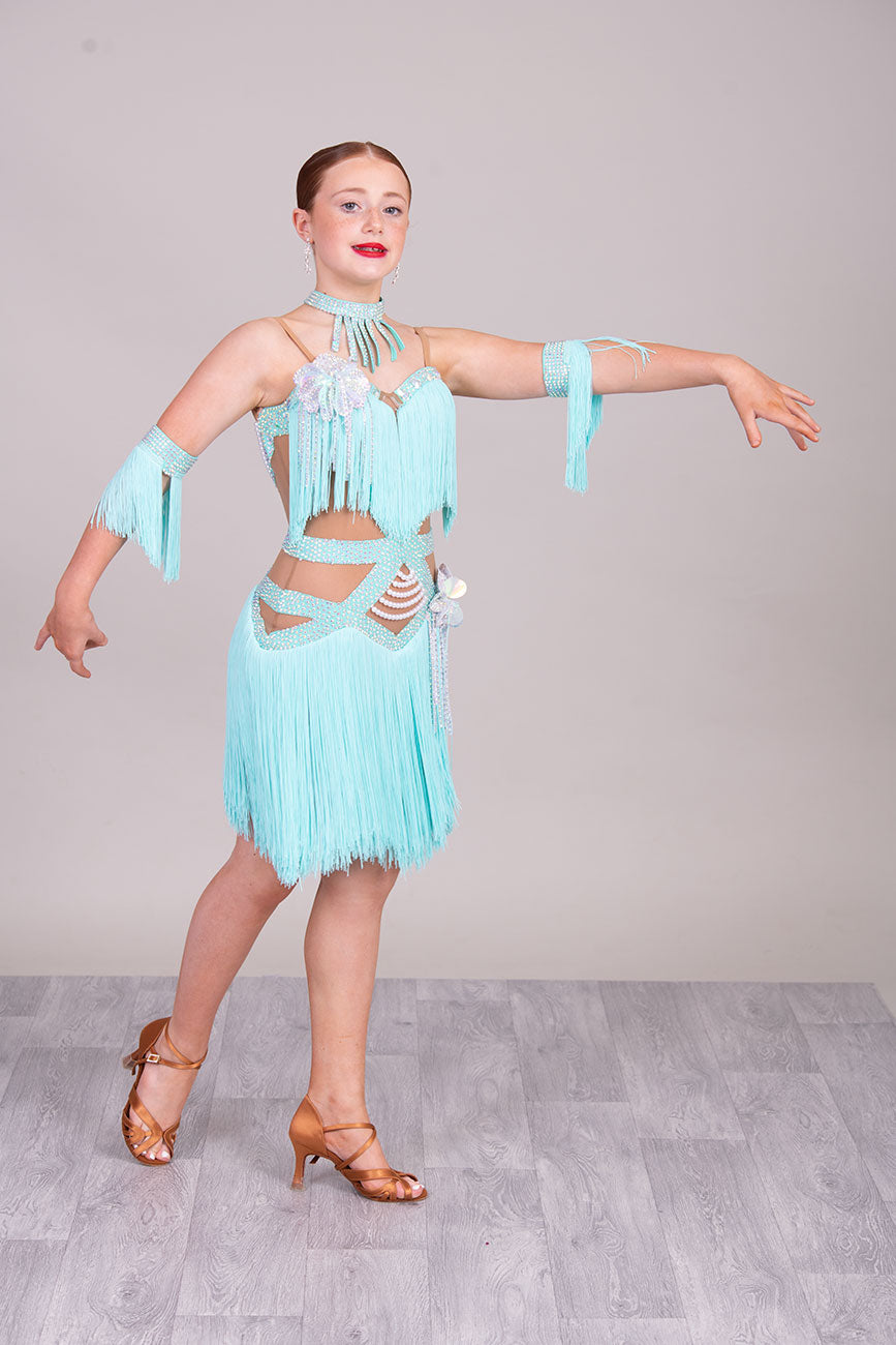 (BUDGET)8 Icey Blue Latin Competition Dance Dress. stoned AB & pearls. Flower to chest & hip, fringe skirts.                                           *****Our New Budget Range are Bought in ready made Costumes, with some detail added by TWDance*****
