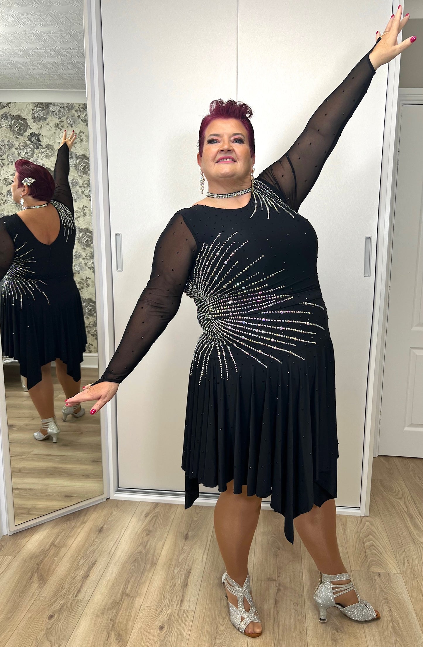 199 Flattering Black Latin Dance Dress. Super Stretchy. Stoned in AB starburst design with handkerchief hem skirt. High back giving option for wearing own bra.