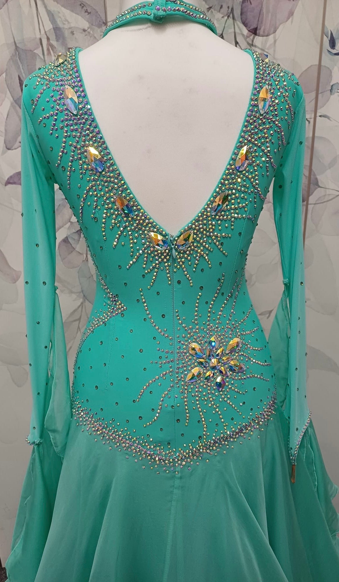 051. Stunning Mint Green Competition Ballroom Dance Dress. Heavily stoned in AB with Mesh detailing to the front. Detachable floats