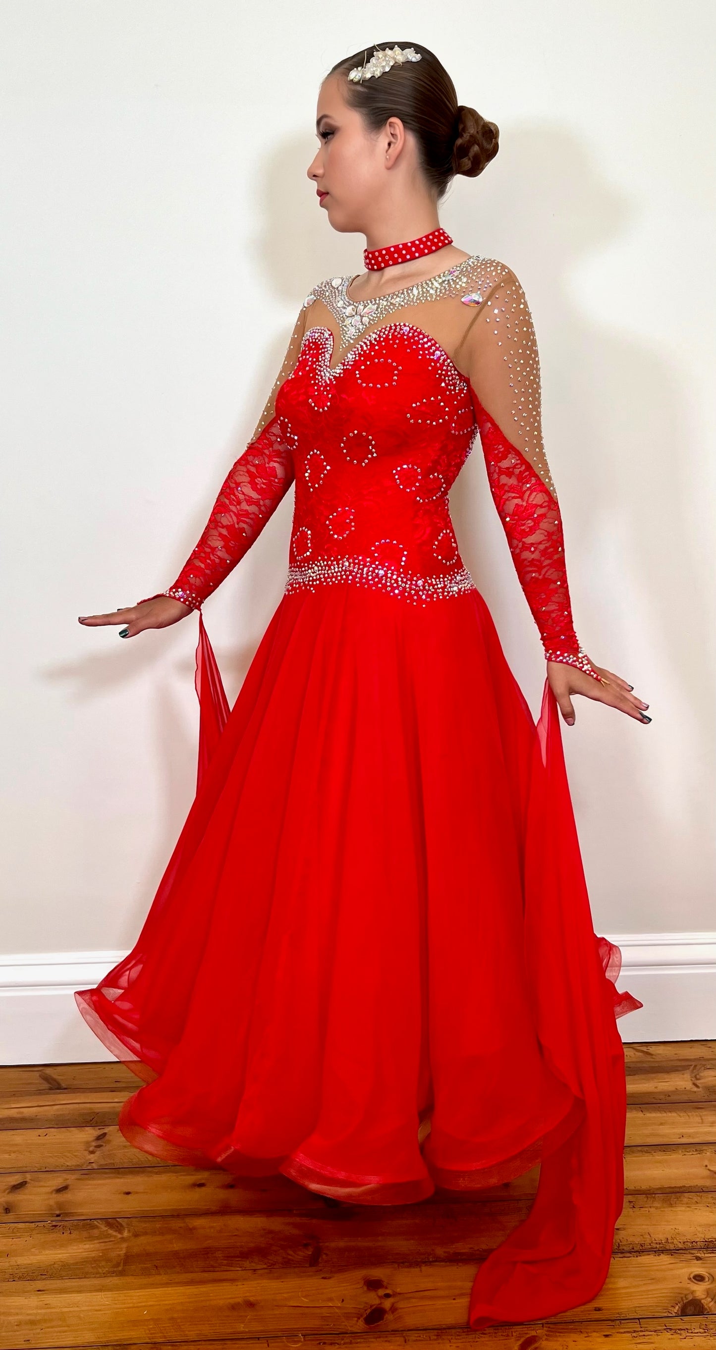 245 Red Ballroom Dress. Decorated in AB stones with bodice chest detail.
