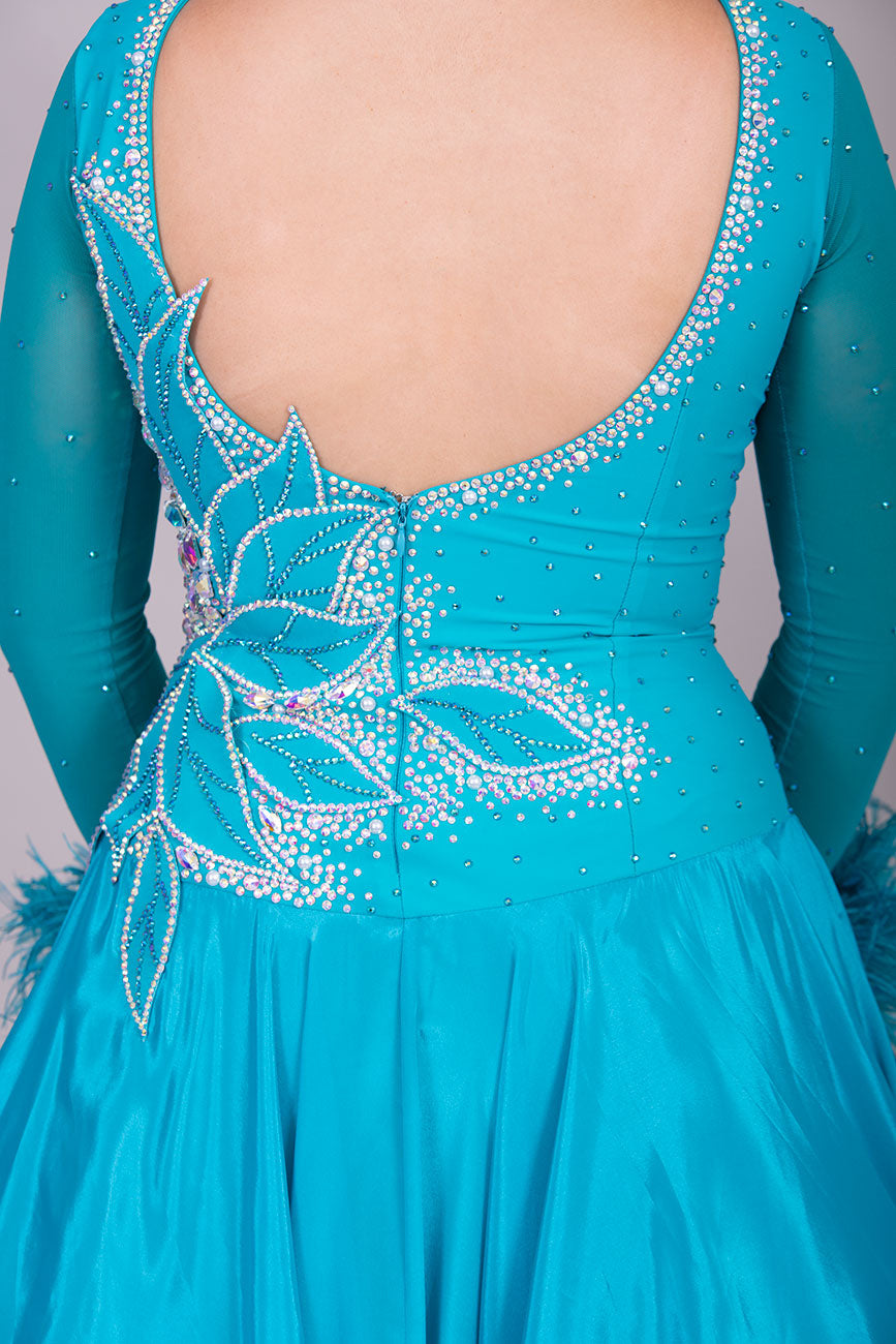 26B “TWD ELITE” Teal competition Ballroom/Sequence Dance dress. New Fuller skirts/Underskirts with 3D design to front and back. Stoned in AB & Blue Zircon. Detachable Ostrich Feather Floats
