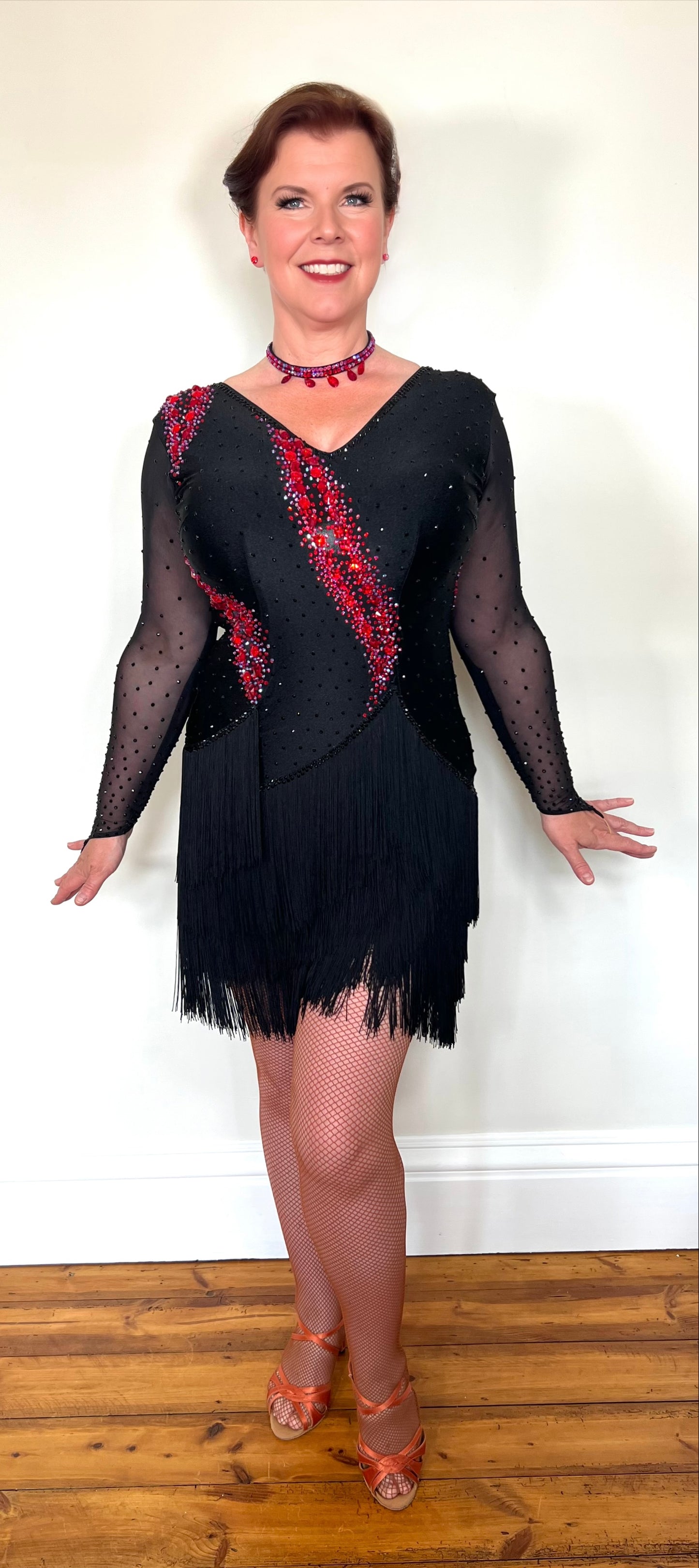 283 Black & Fuschia Pink Latin Dance Dress. Black Fringe detailed skirt design. Stoned in Red, Red AB & Jet. High back to wear own bra if needed.