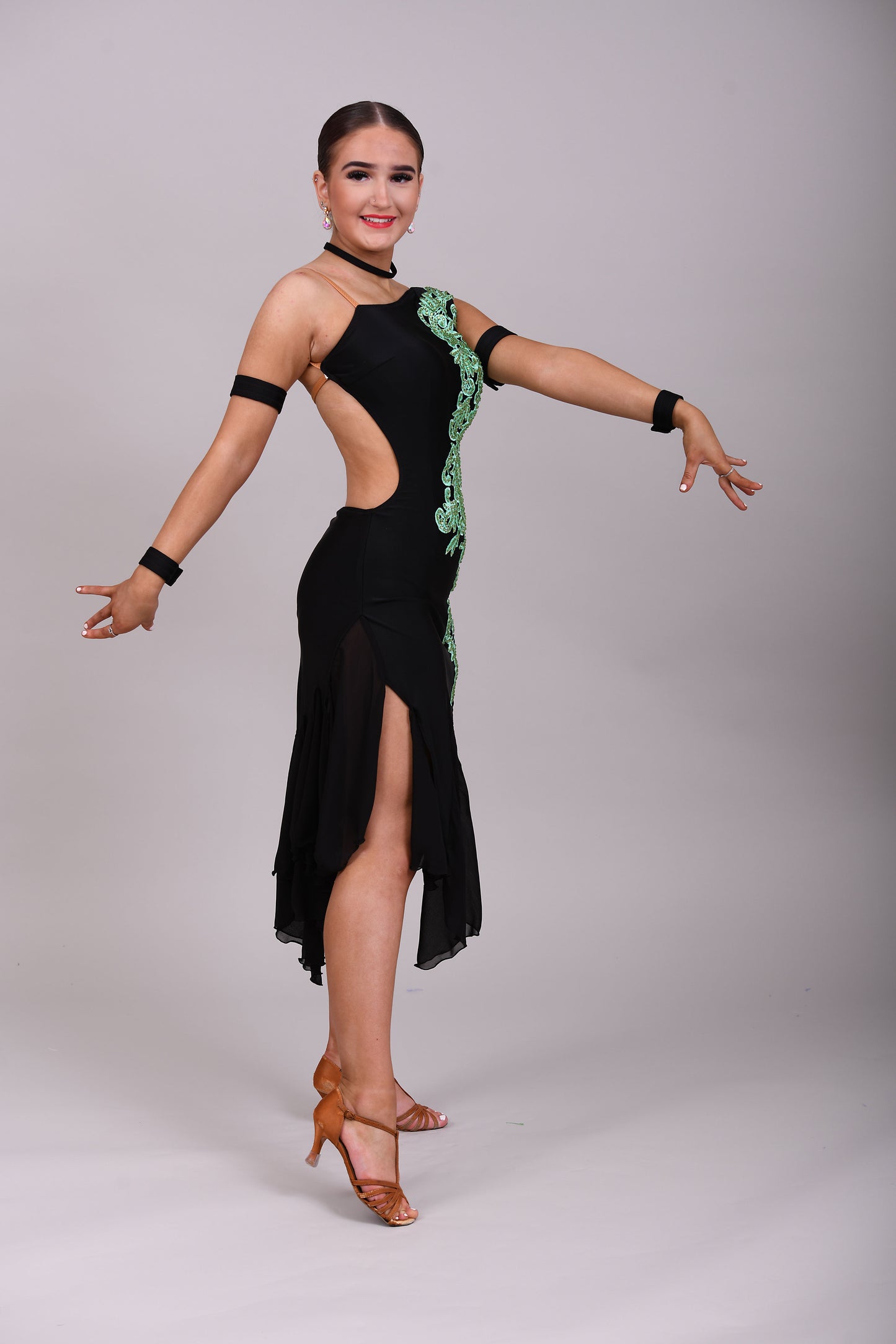 100 Black mesh on Lycra with green motifs and mesh godets Latin dress. Olivine stoned motifs.