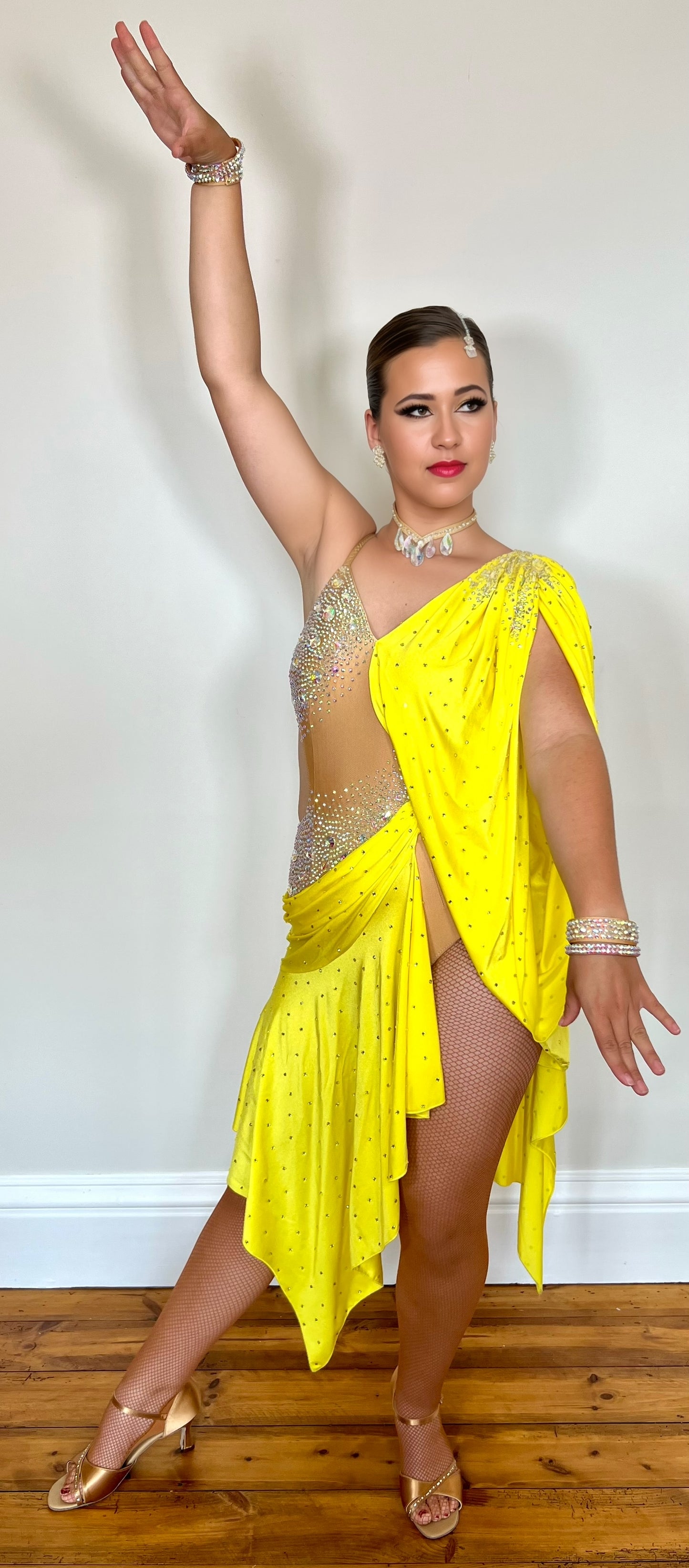 083 Yellow Lycra one Shoulder Latin Dress. Flesh leotard decorated in AB stones. Full frilled skirt for maximum movement.
