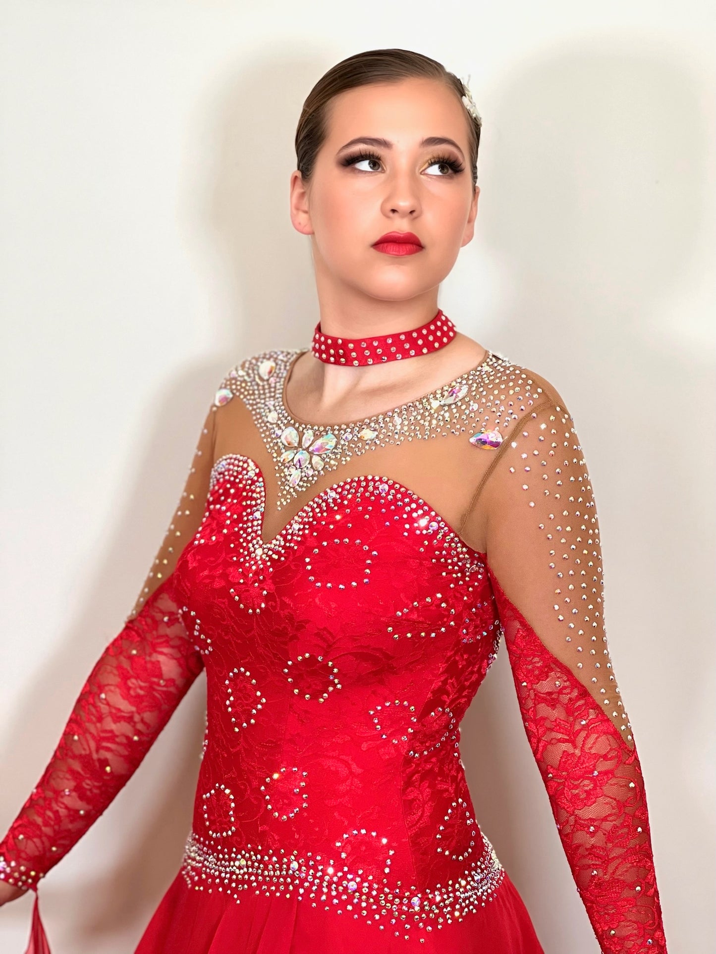 245 Red Ballroom Dress. Decorated in AB stones with bodice chest detail.