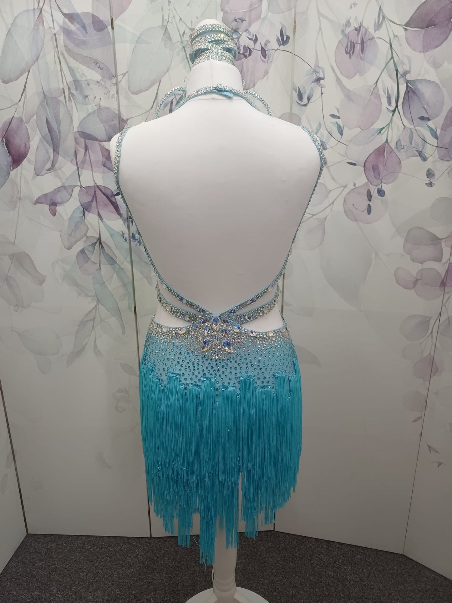 47L Paradise Blue Competition Latin Dance Dress. Beautiful detailing throughout with open design & strap details to the front. Comes with 8 bangles & matching Earrings. ❤️Showroom Appointments Available❤️