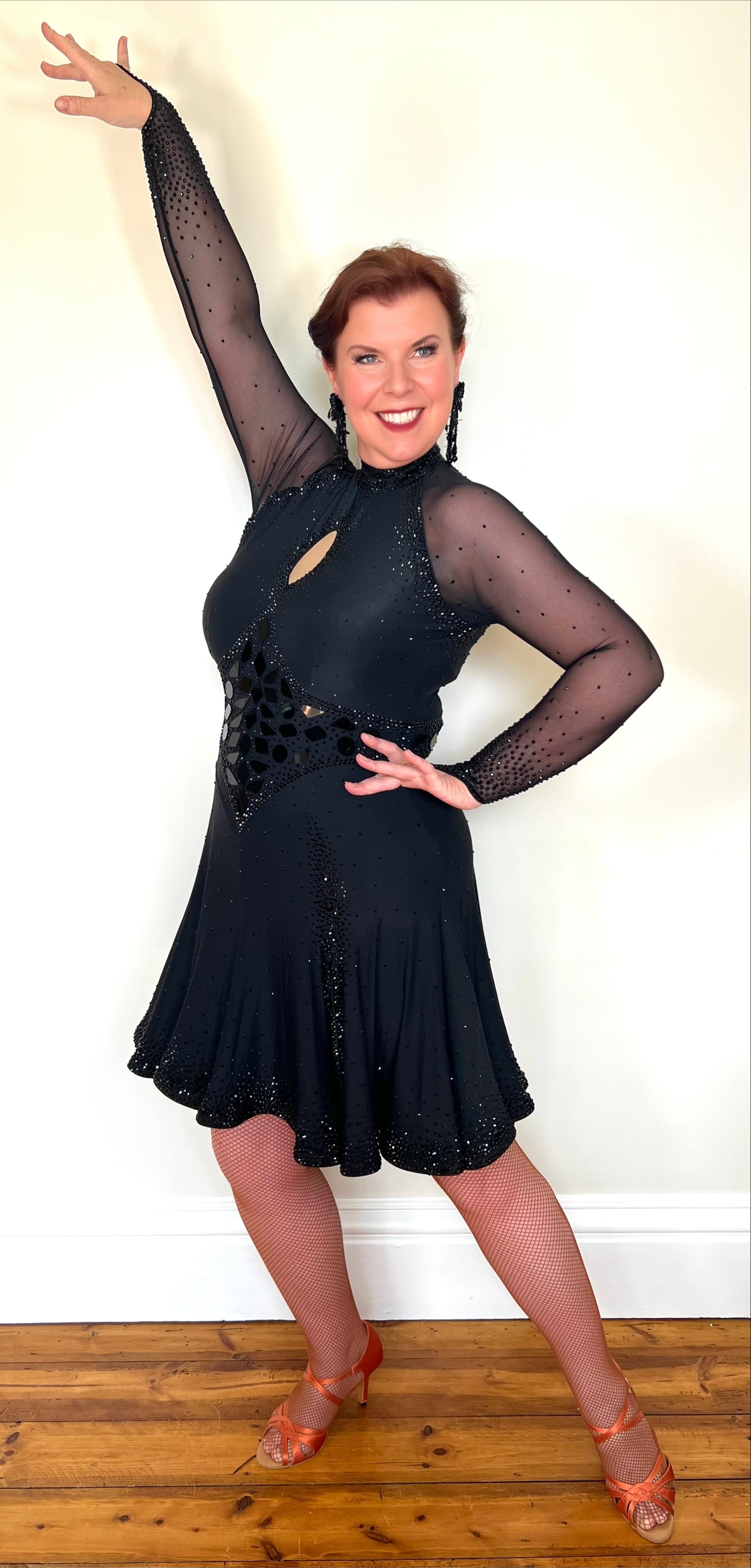 179 Classy Black Latin Dance Dress. Stones in Jet with Jet Mirrors. Stoned Front Side split giving lots of movement to a very full skirt. High back for option of wearing own bra.