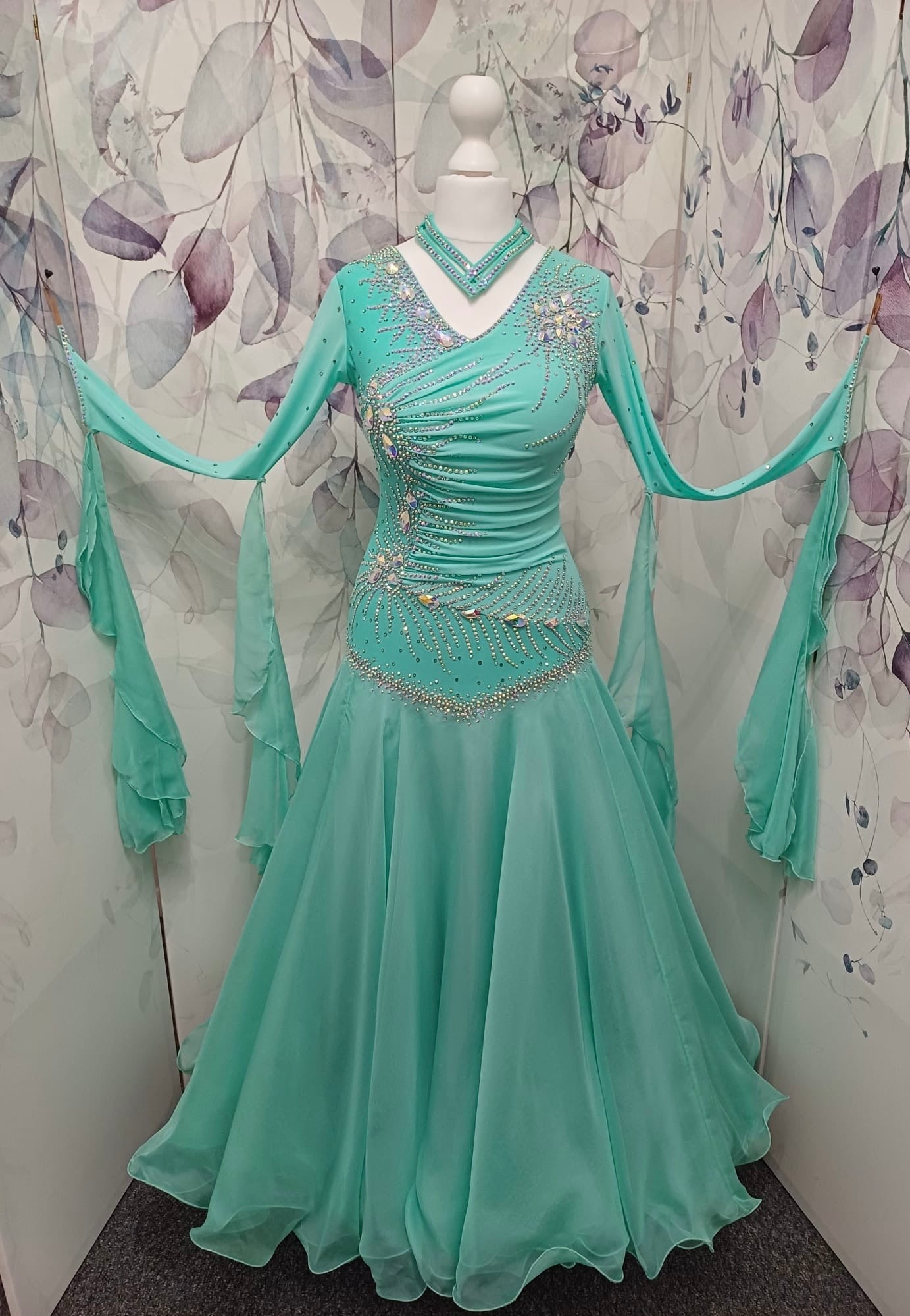 051. Stunning Mint Green Competition Ballroom Dance Dress. Heavily stoned in AB with Mesh detailing to the front. Detachable floats