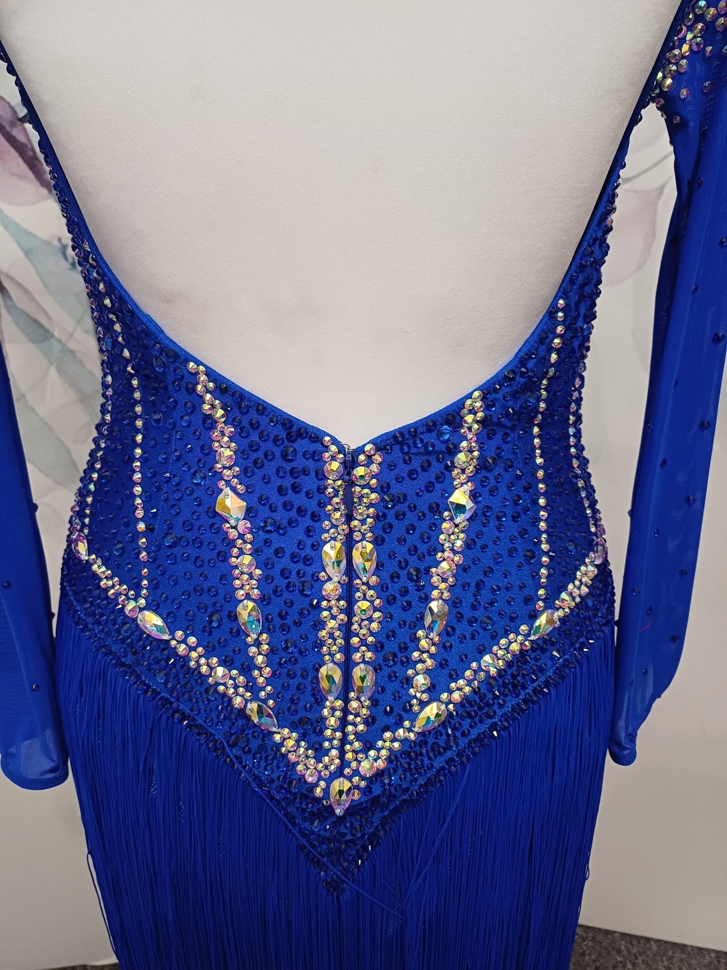 014 Royal blue Competition Latin Dance Dress. Heavily stoned in AB & Sapphire. Full fringed skirt for maximum movement. Neck detailing. Comes with long stoned gloves & Bracelets