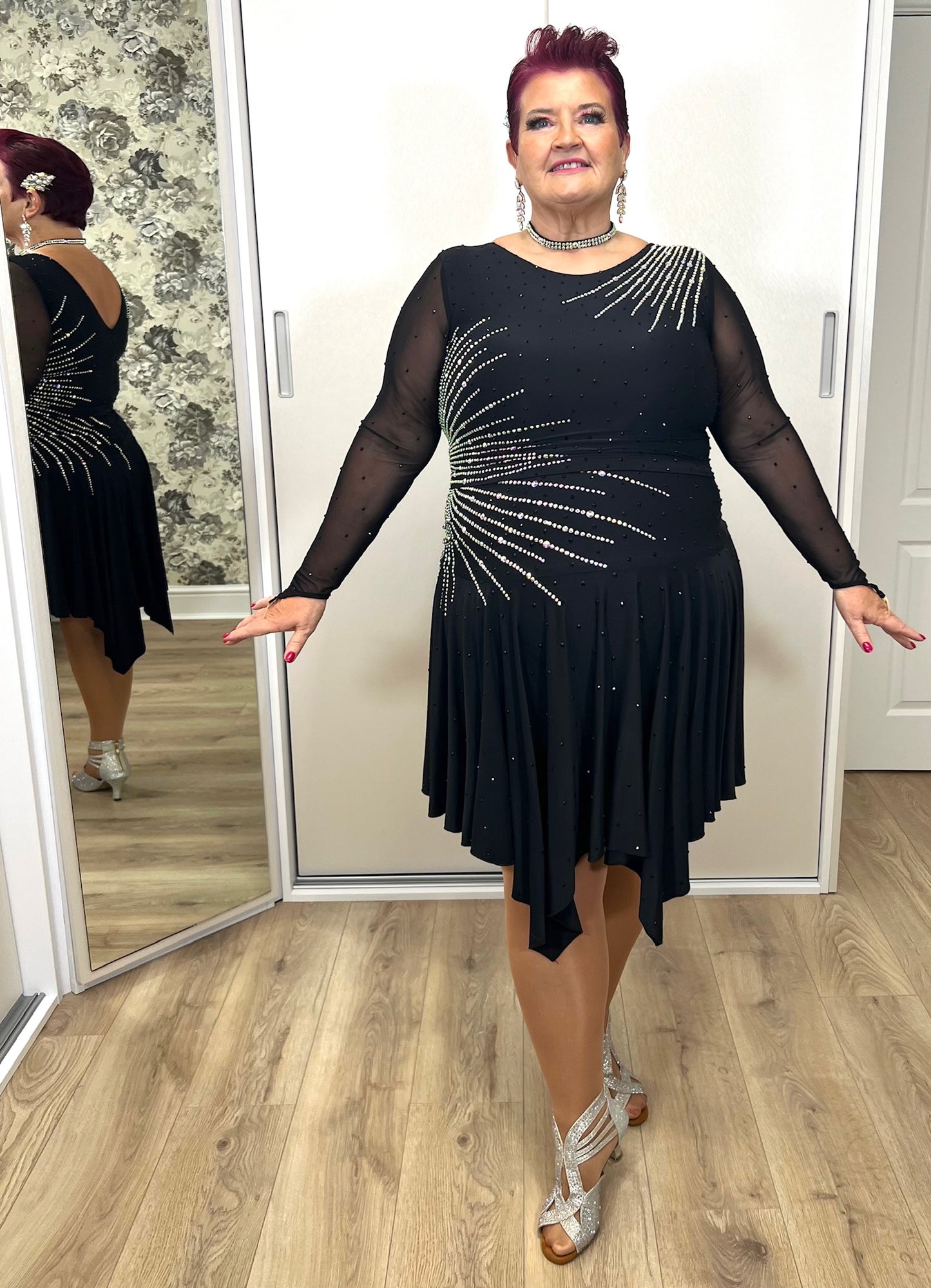 199 Flattering Black Latin Dance Dress. Super Stretchy. Stoned in AB starburst design with handkerchief hem skirt. High back giving option for wearing own bra.