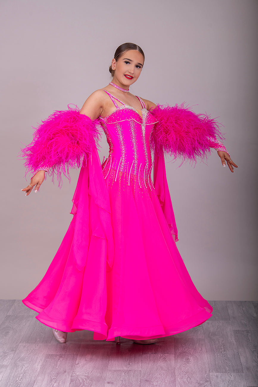 006 Cerise Pink Competition Ballroom/Sequence Dance dress. Comes with Gloves, Floats & Ostrich feathers. Stoned in AB, Rose & Rose AB. 3D detail to the waste.