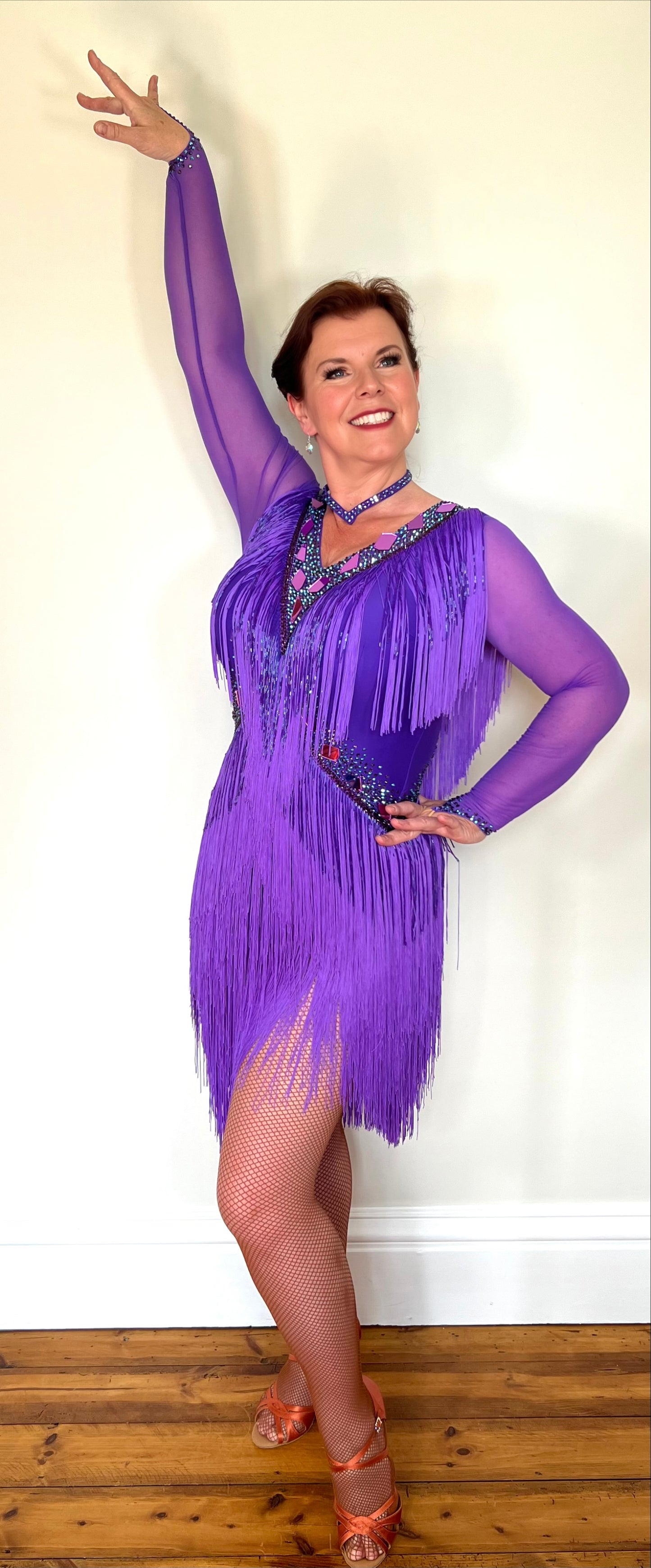 181 Purple Latin Dance Dress. Very full layered fringe. Decorated with purple mirrors, purple bead droppers and purple ab stones. High back to give option for wearing own bra.