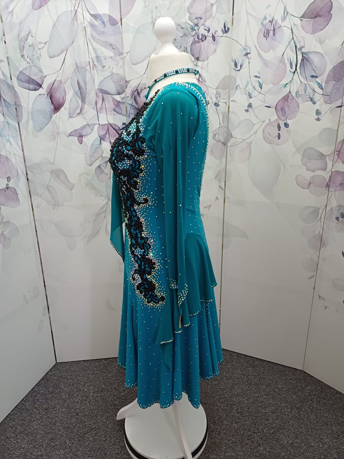 60L Teal Competition Latin Dance Dress. Beautiful Teal colour. Black pearls & AB stones with overlay detail to the chest & Back hip giving flattering lines. ❤️Showroom Appointments Available❤️