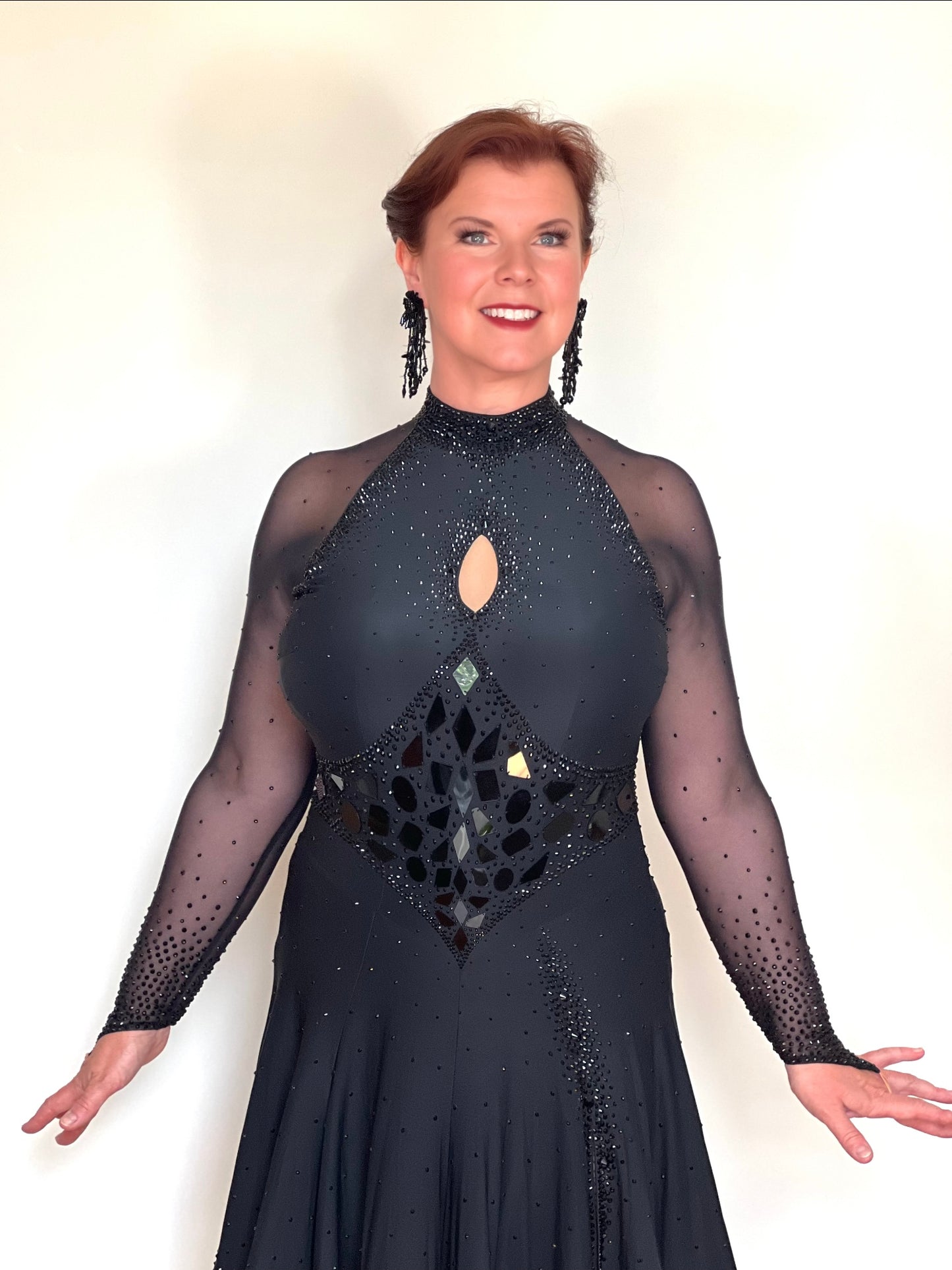 179 Classy Black Latin Dance Dress. Stones in Jet with Jet Mirrors. Stoned Front Side split giving lots of movement to a very full skirt. High back for option of wearing own bra.