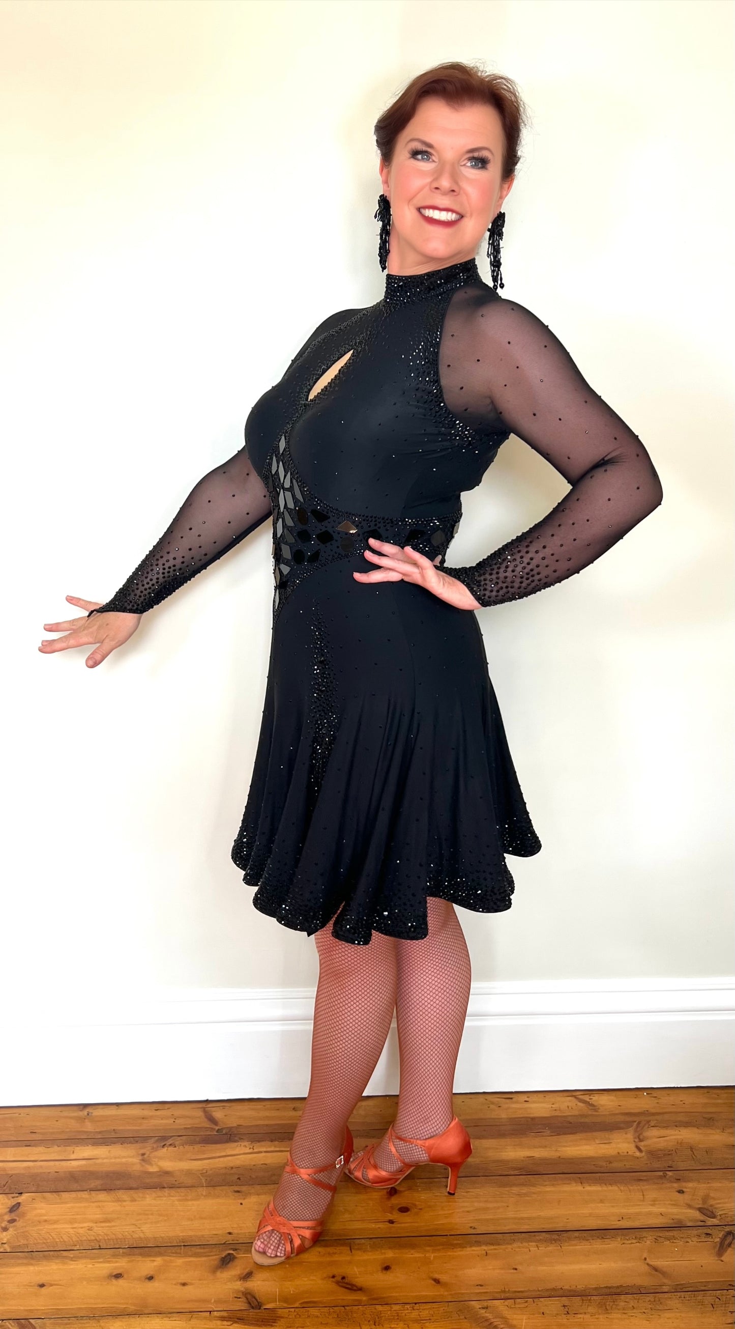 179 Classy Black Latin Dance Dress. Stones in Jet with Jet Mirrors. Stoned Front Side split giving lots of movement to a very full skirt. High back for option of wearing own bra.