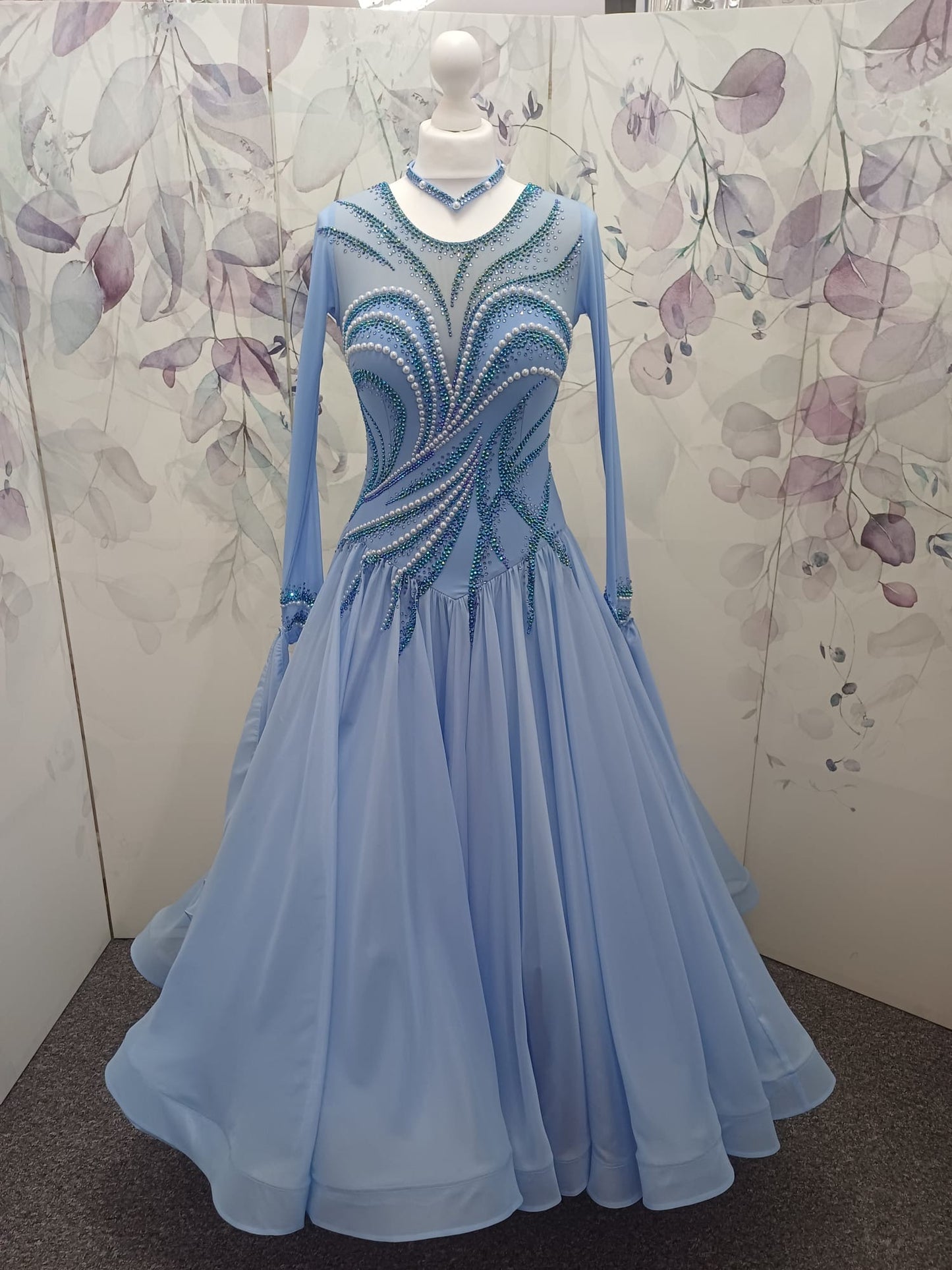 60B TWD ELITE Sky Blue Competition Ballroom/Sequence Dance Dress. New Fuller skirts & Underskirts. Beautiful patterning in Light Sapphire, AB & Light Sapphire AB with White Pearls. Narrow keyhole back. Detachable floats.❤️Showroom Appointments Available❤️